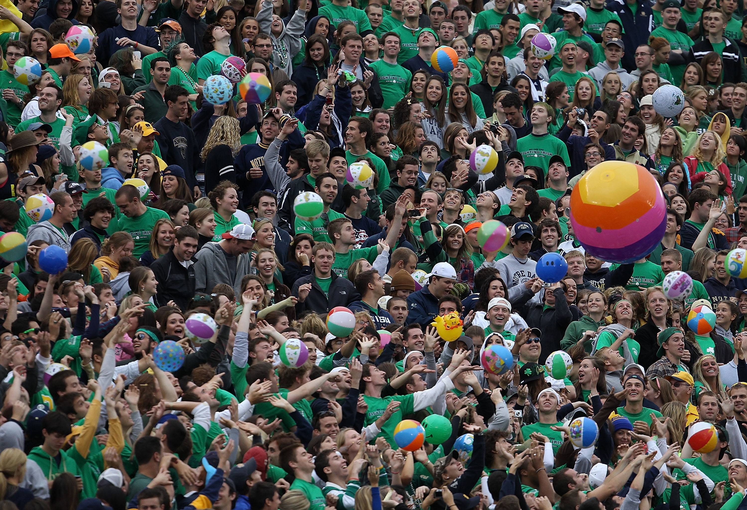 SOUTH BEND, IN - SEPTEMBER 25: Student fans of the Notre Dame Fighting Irish play with beach balls in the stands during a game against the Stanford Cardinal at Notre Dame Stadium on September 25, 2010 in South Bend, Indiana. Stanford defeated Notre Dame 3