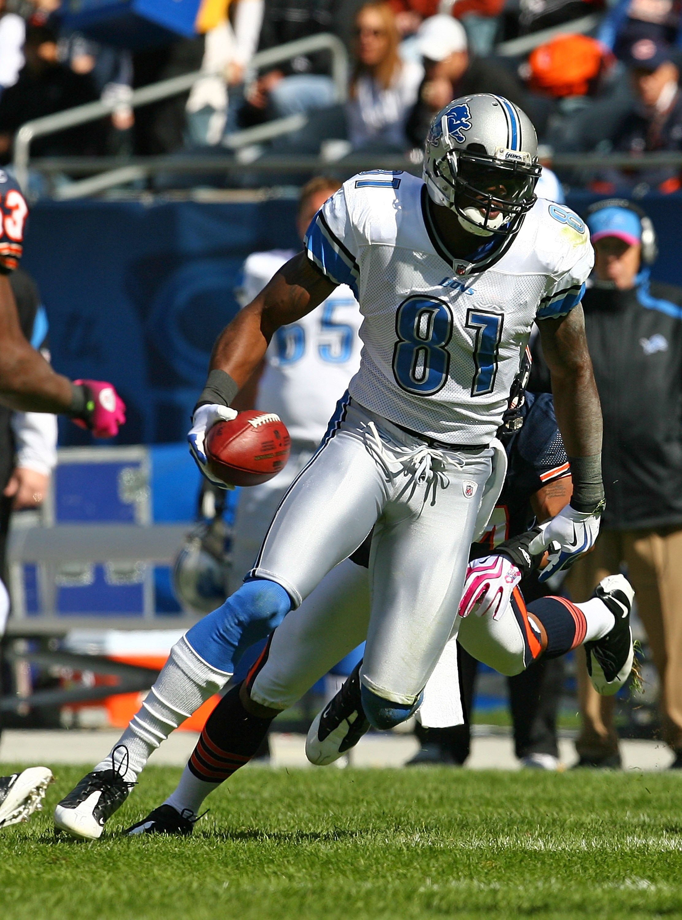 CHICAGO - OCTOBER 04: Calvin Johnson #81 of the Detroit Lions breaks away from Kevin Payne #44 of the Chicago Bears on October 4, 2009 at Soldier Field in Chicago, Illinois. The Bears defeated the Lions 48-24. (Photo by Jonathan Daniel/Getty Images)