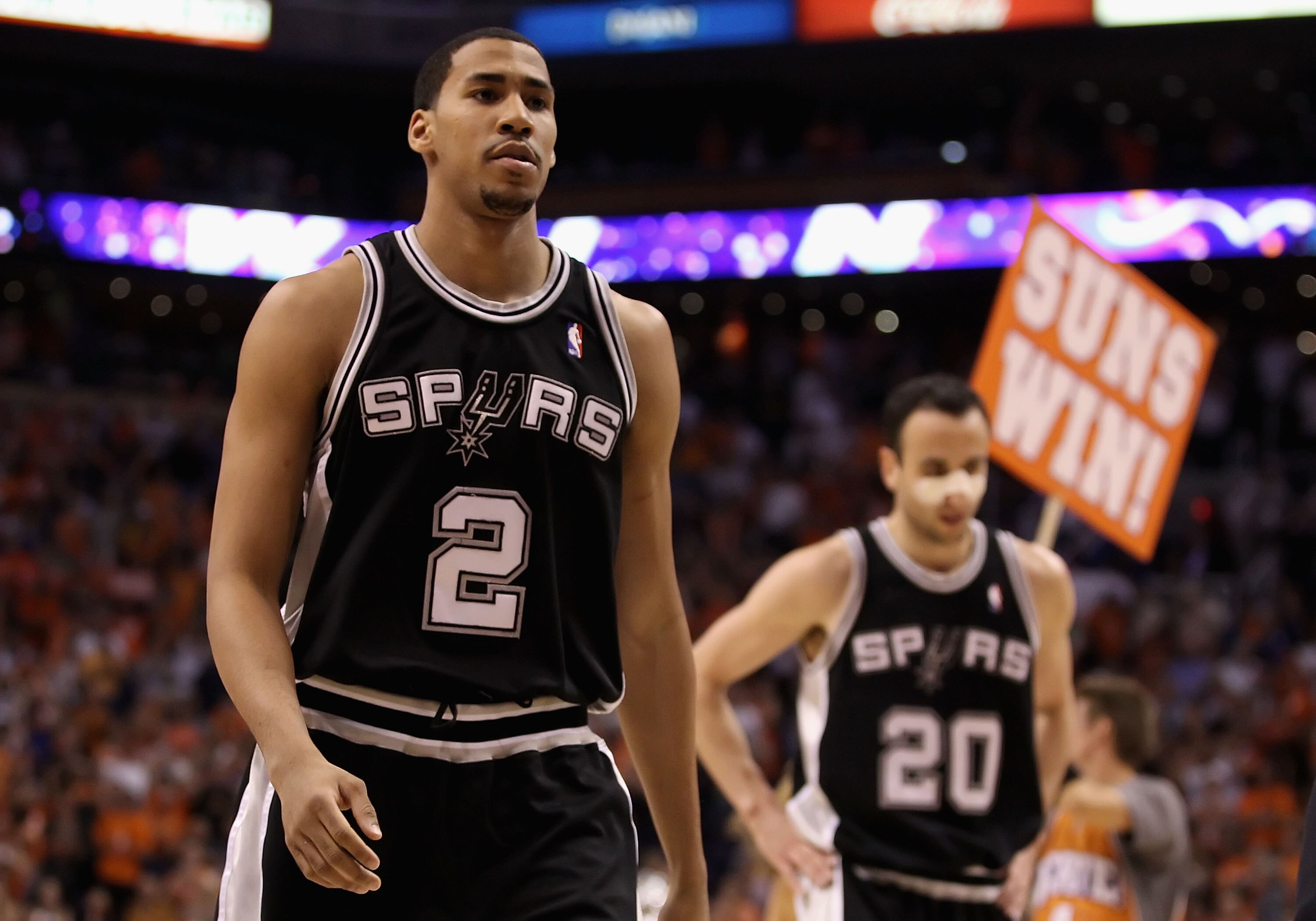 PHOENIX - MAY 05:  Garrett Temple #2 and Manu Ginobili #20 of the San Antonio Spurs walk off the court after being defeated by the Phoenix Suns during Game Two of the Western Conference Semifinals of the 2010 NBA Playoffs at US Airways Center on May 5, 20