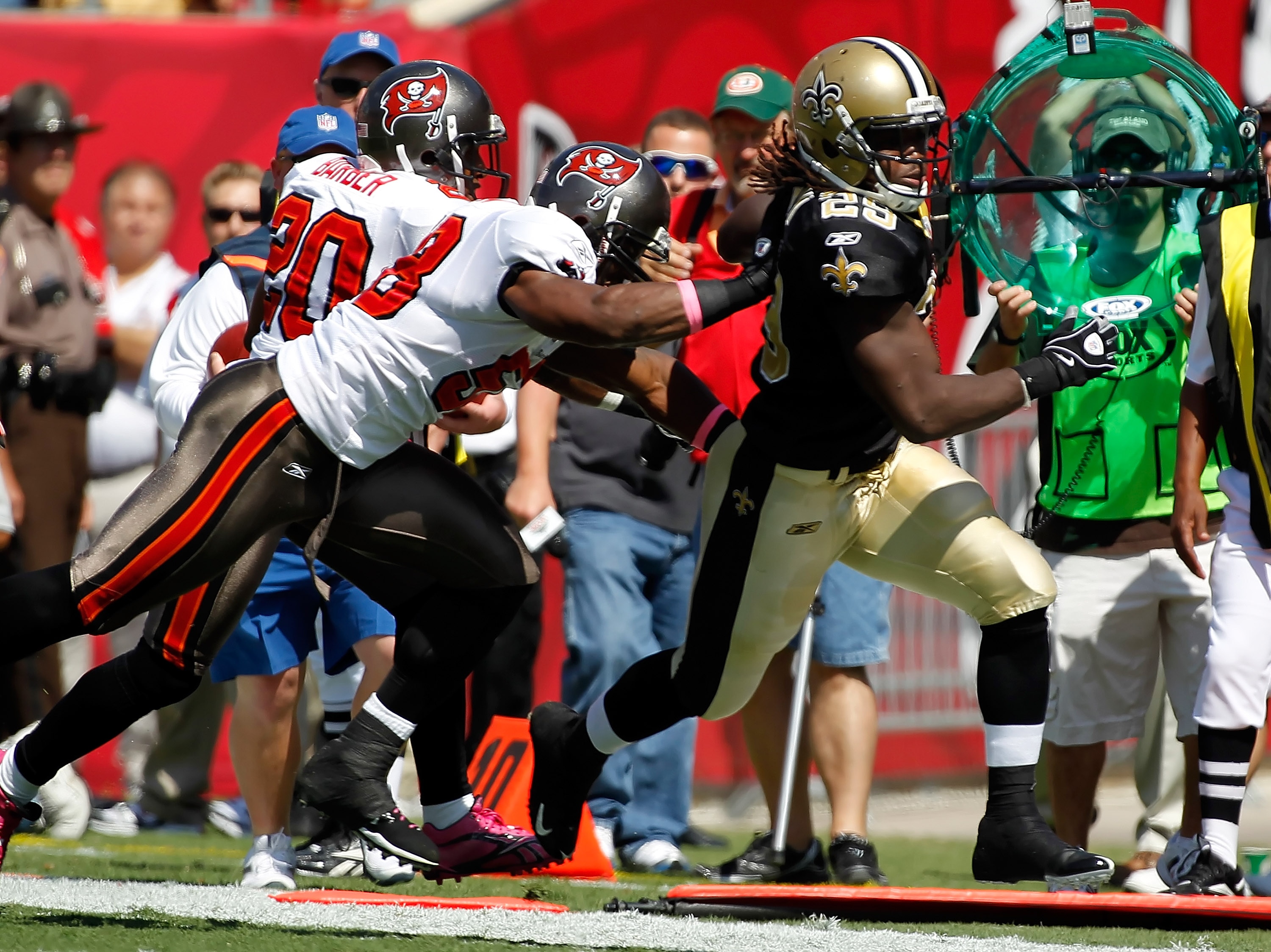 TAMPA, FL - OCTOBER 17:  Running back Chris Ivory #29 of the New Orleans Saints is knocked out of bounds by linebacker Quincy Black #58 of the Tampa Bay Buccaneers during the game at Raymond James Stadium on October 17, 2010 in Tampa, Florida.  (Photo by 