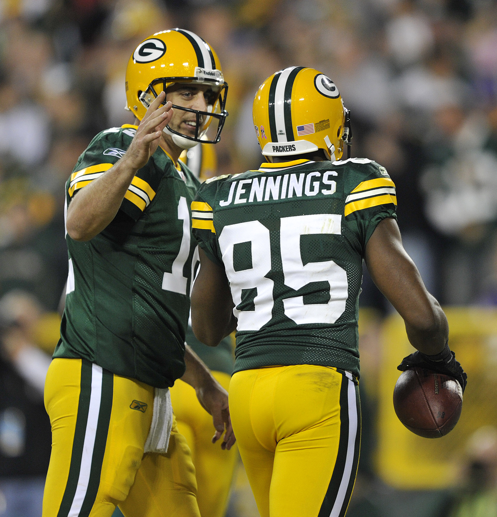 GREEN BAY, WI - OCTOBER 24:  Aaron Rodgers #12 of the Green Bay Packers congratulates Greg Jennings #85 after Jennings' touchdown against the Minnesota Vikings  at Lambeau Field on October 24, 2010 in Green Bay, Wisconsin. (Photo by Jim Prisching/Getty Im