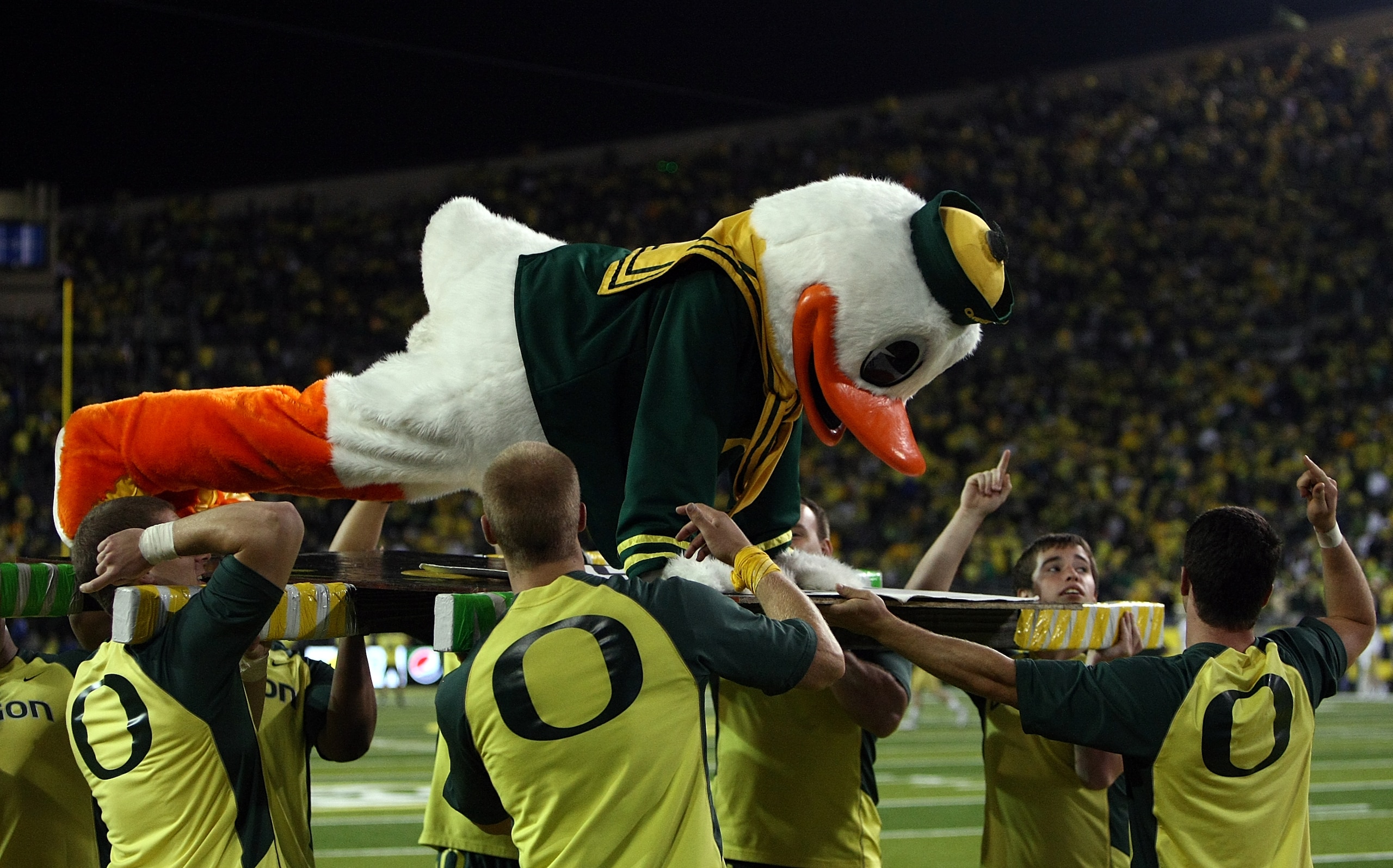 EUGENE, OR - OCTOBER 21: The Oregon Duck mascot does push ups after a touchdown against the UCLA Bruins on October 21, 2010 at the Autzen Stadium in Eugene, Oregon. (Photo by Jonathan Ferrey/Getty Images) EUGENE, OR - OCTOBER 21: The Oregon Duck mascot does push ups after a touchdown against the UCLA Bruins on October 21, 2010 at the Autzen Stadium in Eugene, Oregon. (Photo by Jonathan Ferrey/Getty Images)