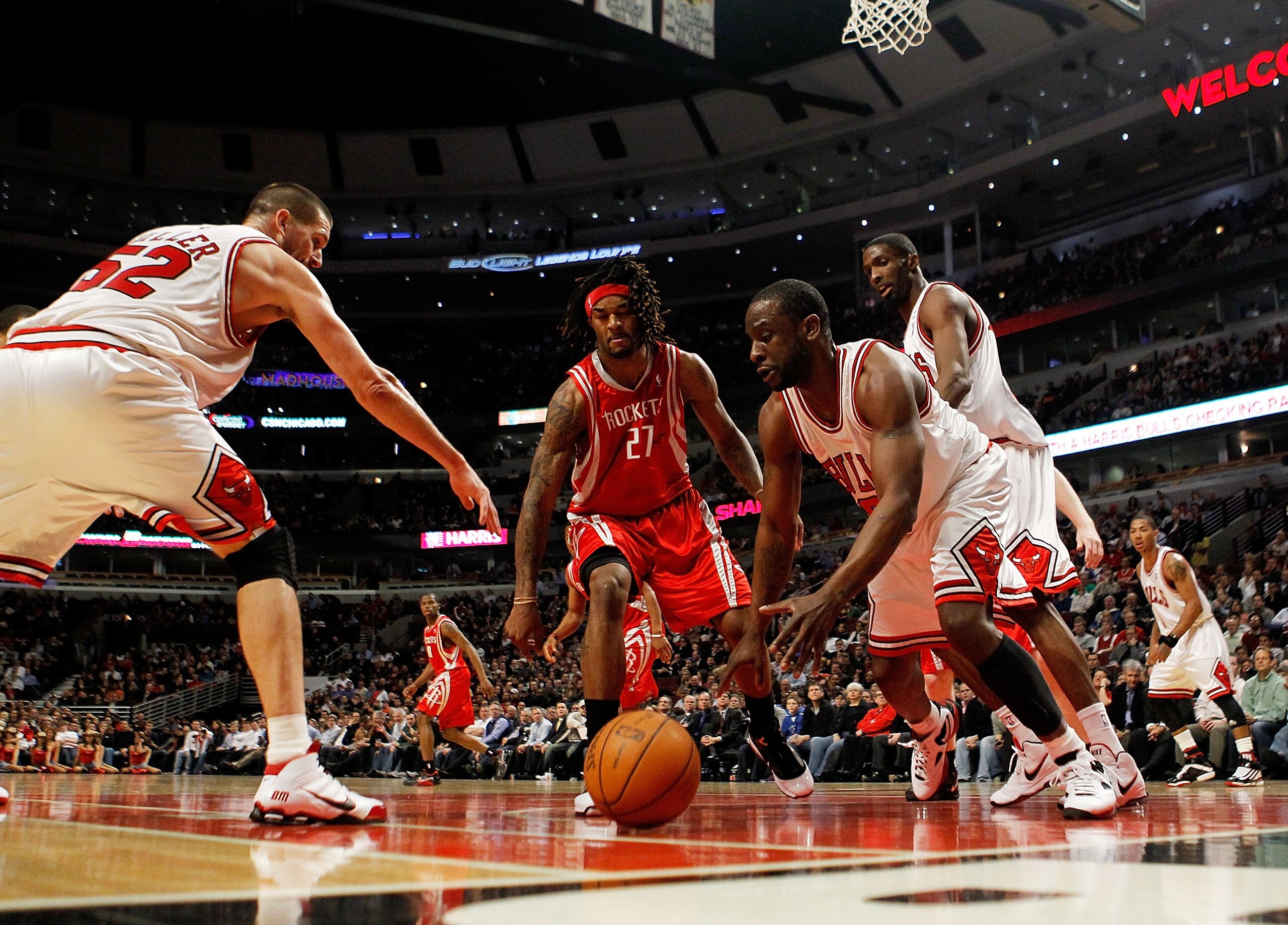 CHICAGO - MARCH 22: Brad Miller #52 (L) and Ronald Murray #6 of the Chicago Bulls and Jordan Hill #27 of the Houston Rockets move toward a loose ball at the United Center on March 22, 2010 in Chicago, Illinois. The Bulls defeated the Rockets 98-88. NOTE T