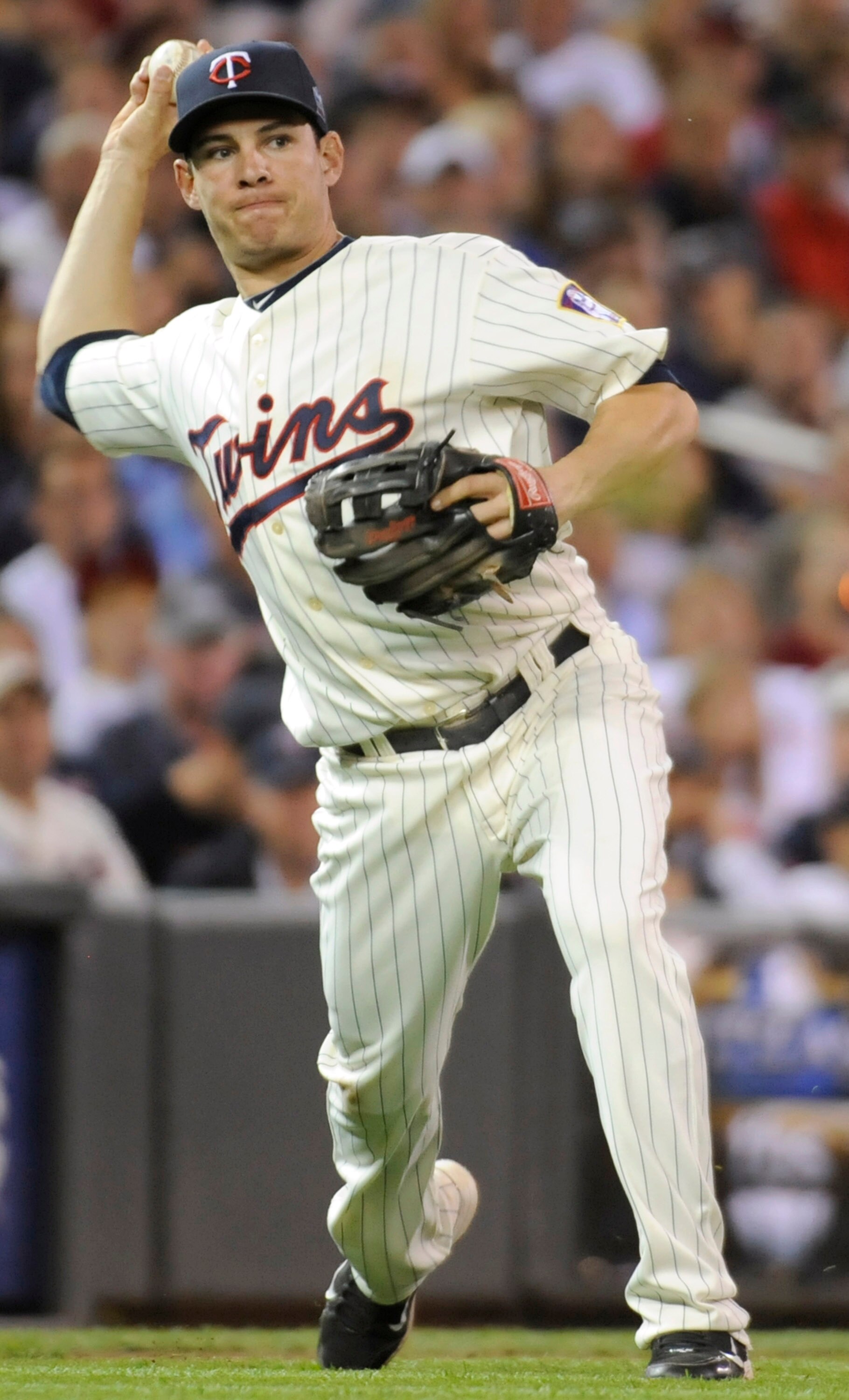 MINNEAPOLIS, MN - OCTOBER 7: Danny Valencia #19 of the Minnesota Twins throws to first during game two of the ALDS game against the New York Yankees on October 7, 2010 at Target Field in Minneapolis, Minnesota. (Photo by Hannah Foslien /Getty Images)
