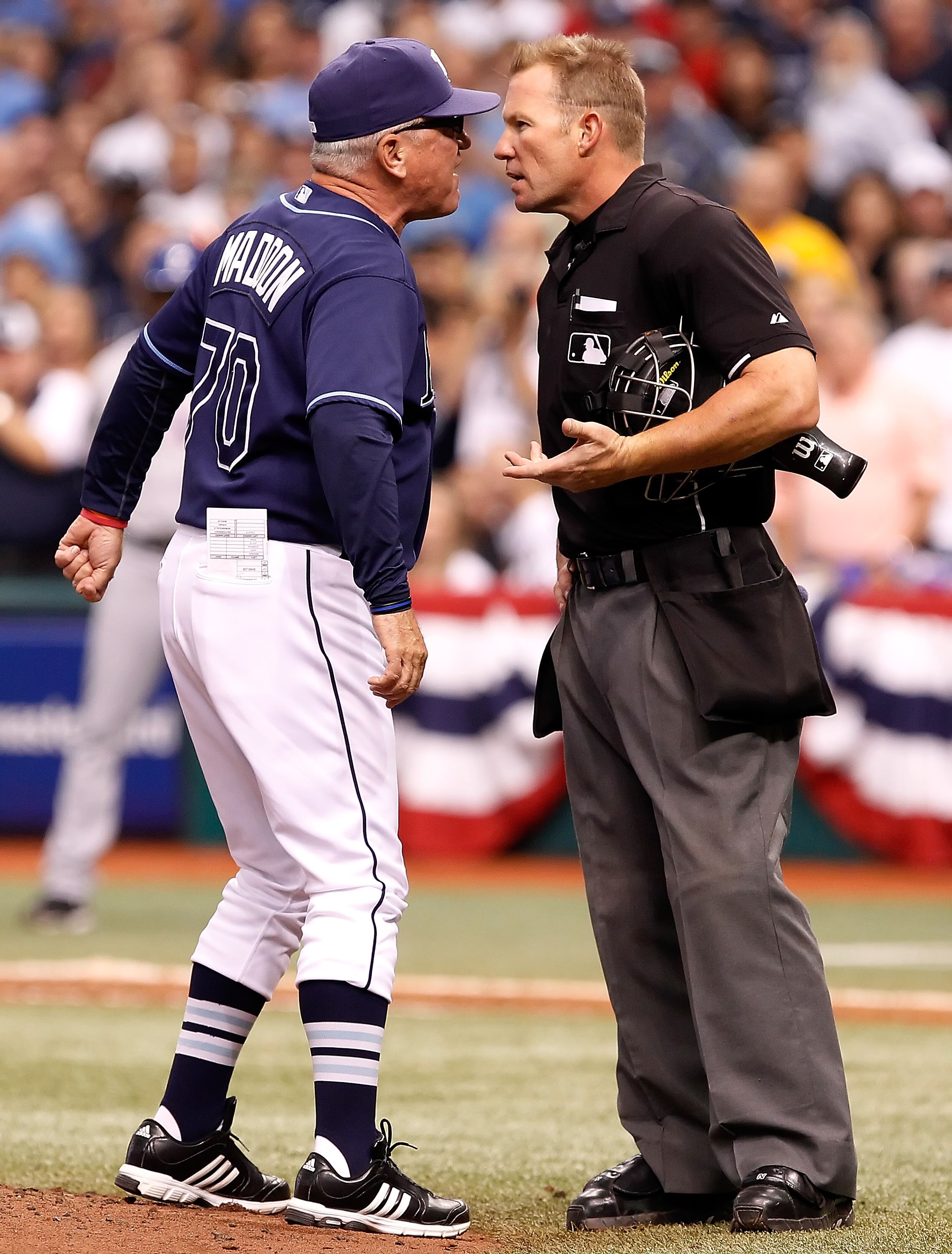 ST. PETERSBURG - OCTOBER 07:  Manager Joe Maddon #70 of the Tampa Bay Rays argues with homeplate umpire Jim Wolf after being ejected against the Texas Rangers during Game 2 of the ALDS at Tropicana Field on October 7, 2010 in St. Petersburg, Florida.  (Ph