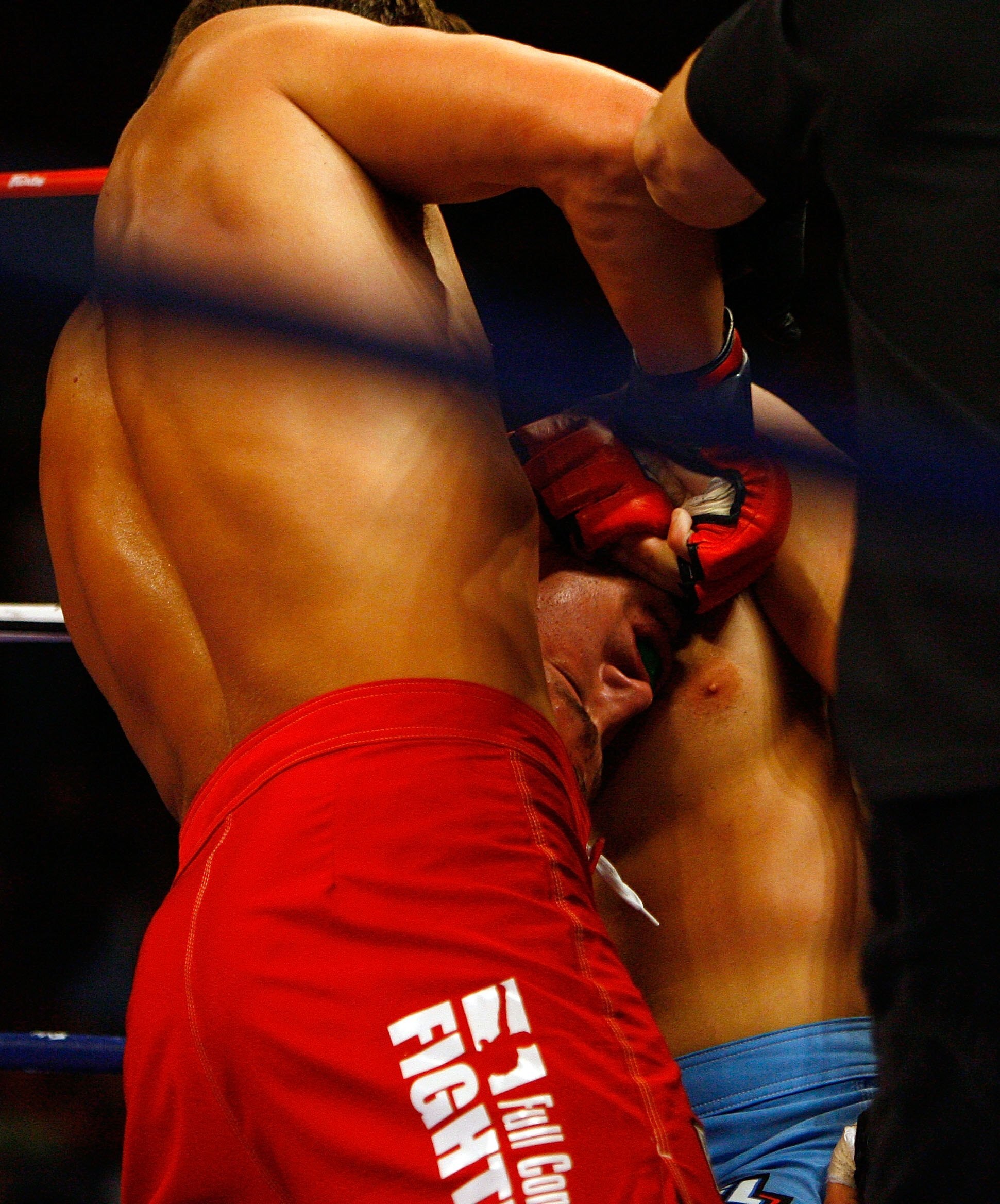EAST RUTHERFORD, NJ - AUGUST 02:  Dan Miller (red) of the New York Pitbulls puts the choke hold on Dave Phillips of the Tokyo Sabres during the IFL semifinals at the Continental Airlines Arena on August 2, 2007 in East Rutherford, New Jersey.  (Photo by R