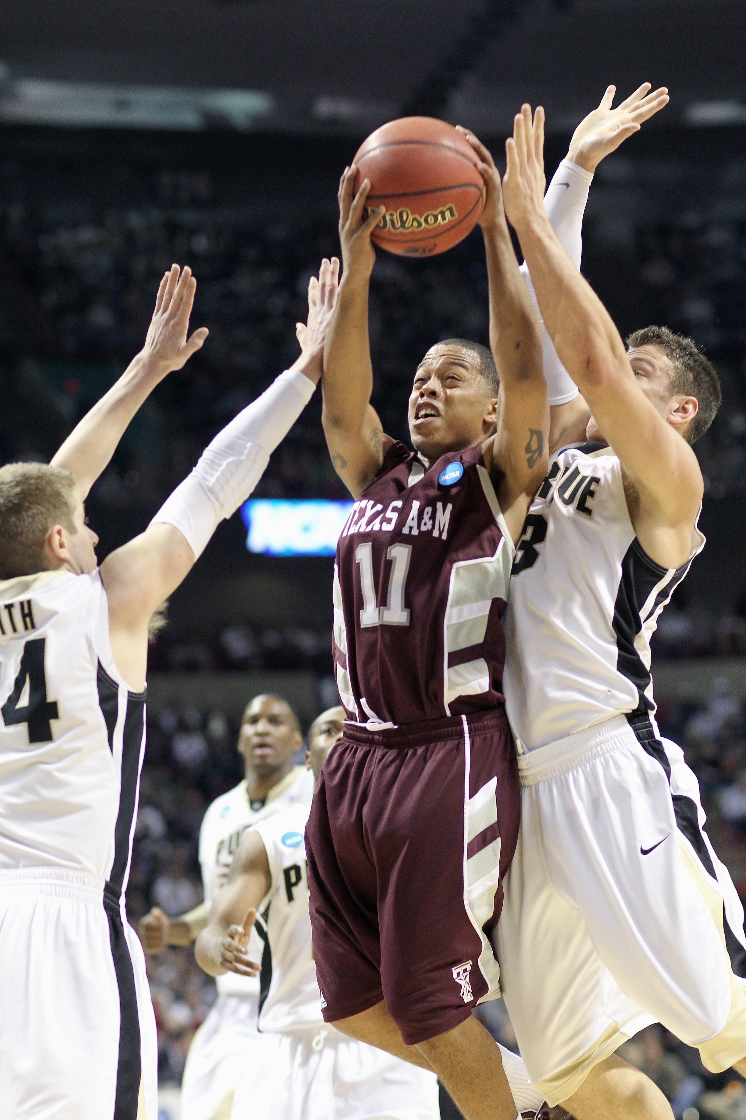 SPOKANE, WA - MARCH 21: B.J. Holmes #11 of the Texas A&M Aggies takes a shot against the Purdue Boilermakers during the second round of the 2010 NCAA men's basketball tournament at the Spokane Arena on March 21, 2010 in Spokane, Washington. Purdue defeate
