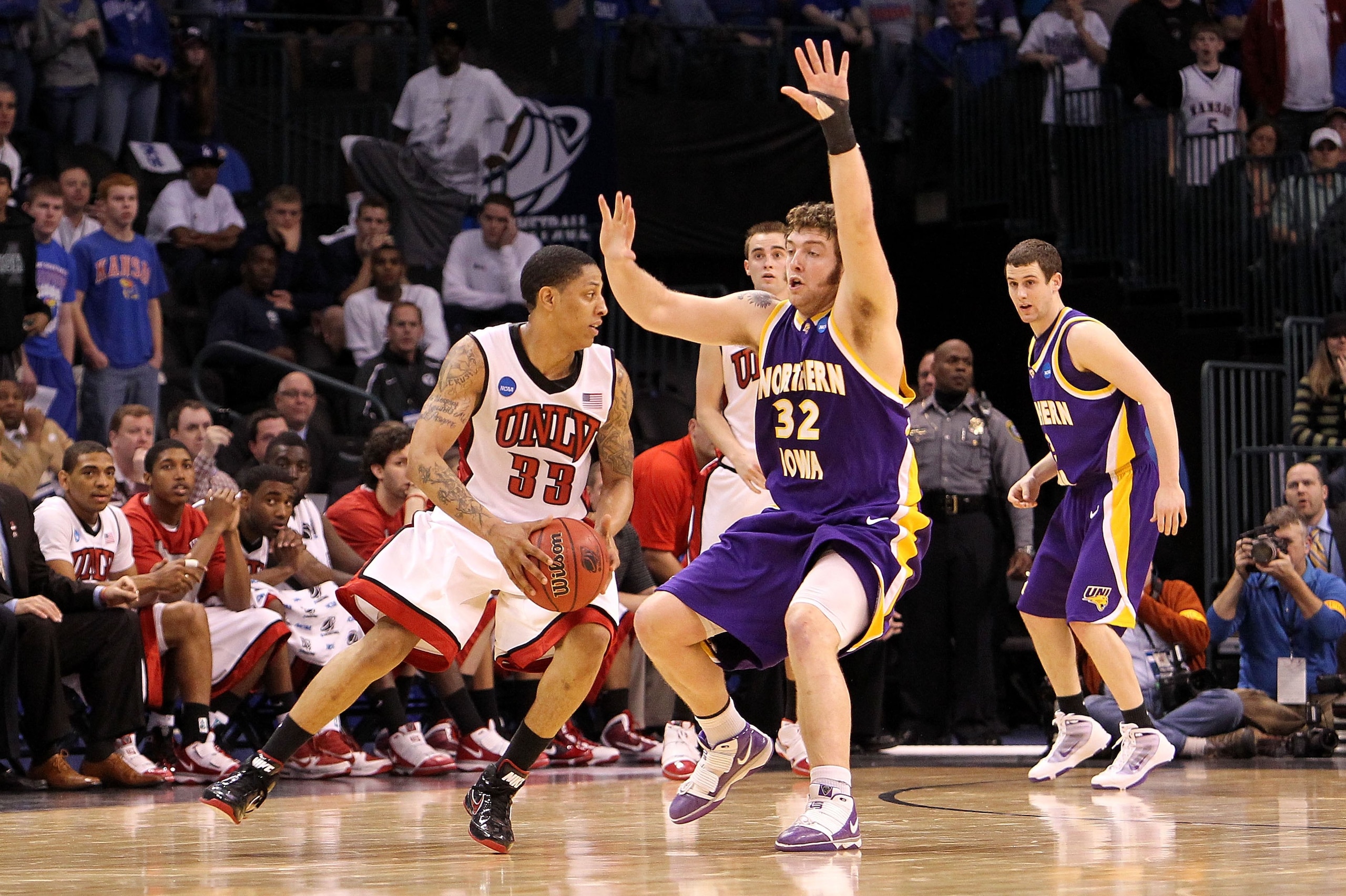 OKLAHOMA CITY - MARCH 18:  Tre'Von Willis #33 of the UNLV Rebels drives against Lucas O'Rear #32 of the Northern Iowa Panthers during the first round of the 2010 NCAA men's basketball tournament at Ford Center on March 18, 2010 in Oklahoma City, Oklahoma.