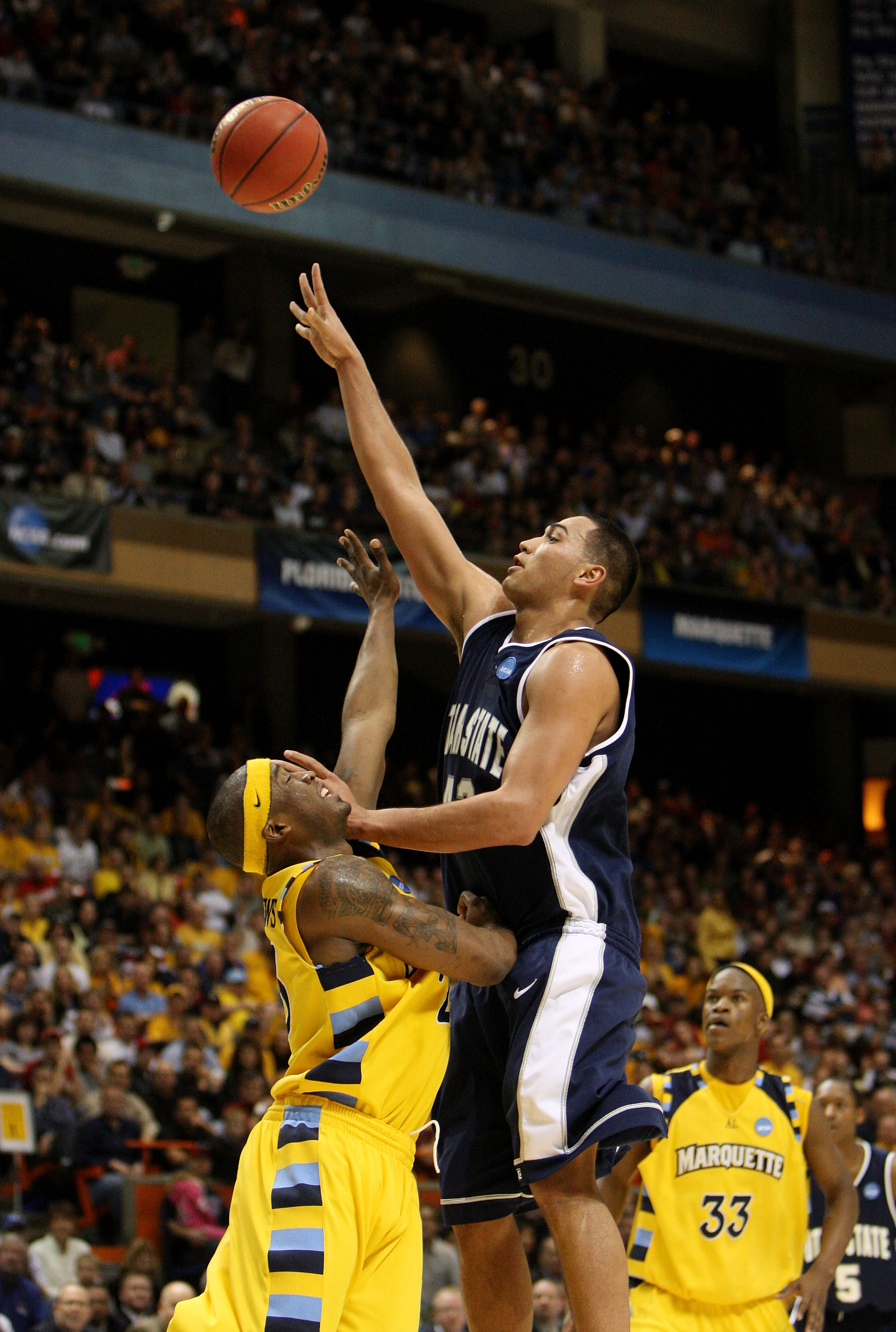 BOISE, ID - MARCH 20:  Forward Tai Wesley #42 of the Utah State Aggies shoots ball against the Marquette Golden Eagles in the first round of the NCAA Division I Men's Basketball Tournament at the Taco Bell Arena on March 20, 2009 in Boise, Idaho.  (Photo