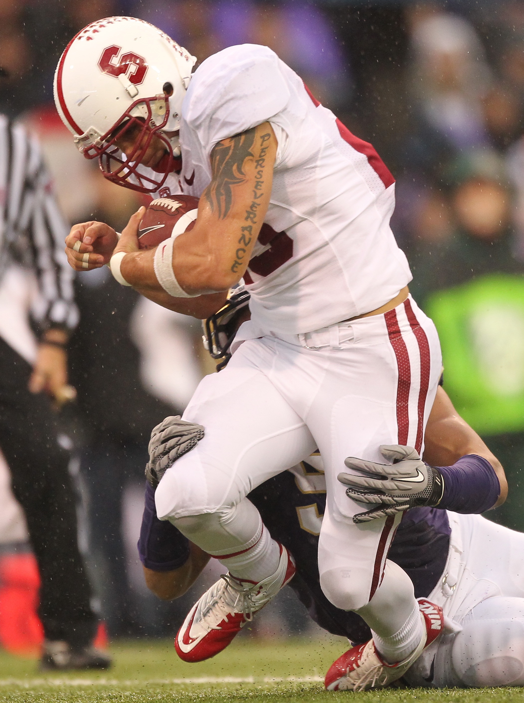 SEATTLE - OCTOBER 30:  Running back Tyler Gaffney #25 of the Stanford Cardinal rushes against Hau'oli Jamora #52 of the Washington Huskies on October 30, 2010 at Husky Stadium in Seattle, Washington. Stanford won 41-0. (Photo by Otto Greule Jr/Getty Image