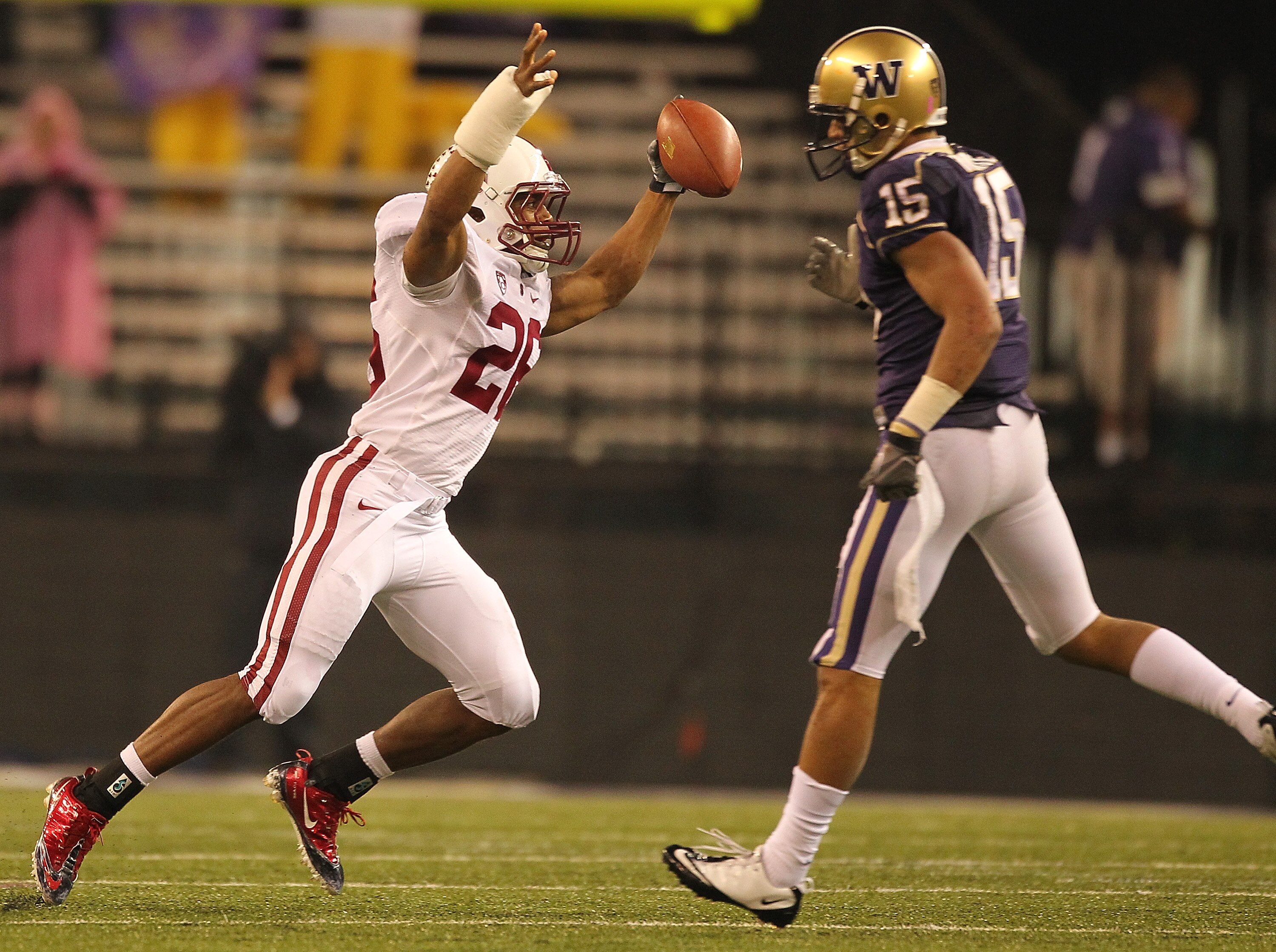 SEATTLE - OCTOBER 30:  Safety Delano Howell #26 of the Stanford Cardinal celebrates after making an interception against Jermaine Kearse #15 of the Washington Huskies on October 30, 2010 at Husky Stadium in Seattle, Washington. Stanford defeated Washingto
