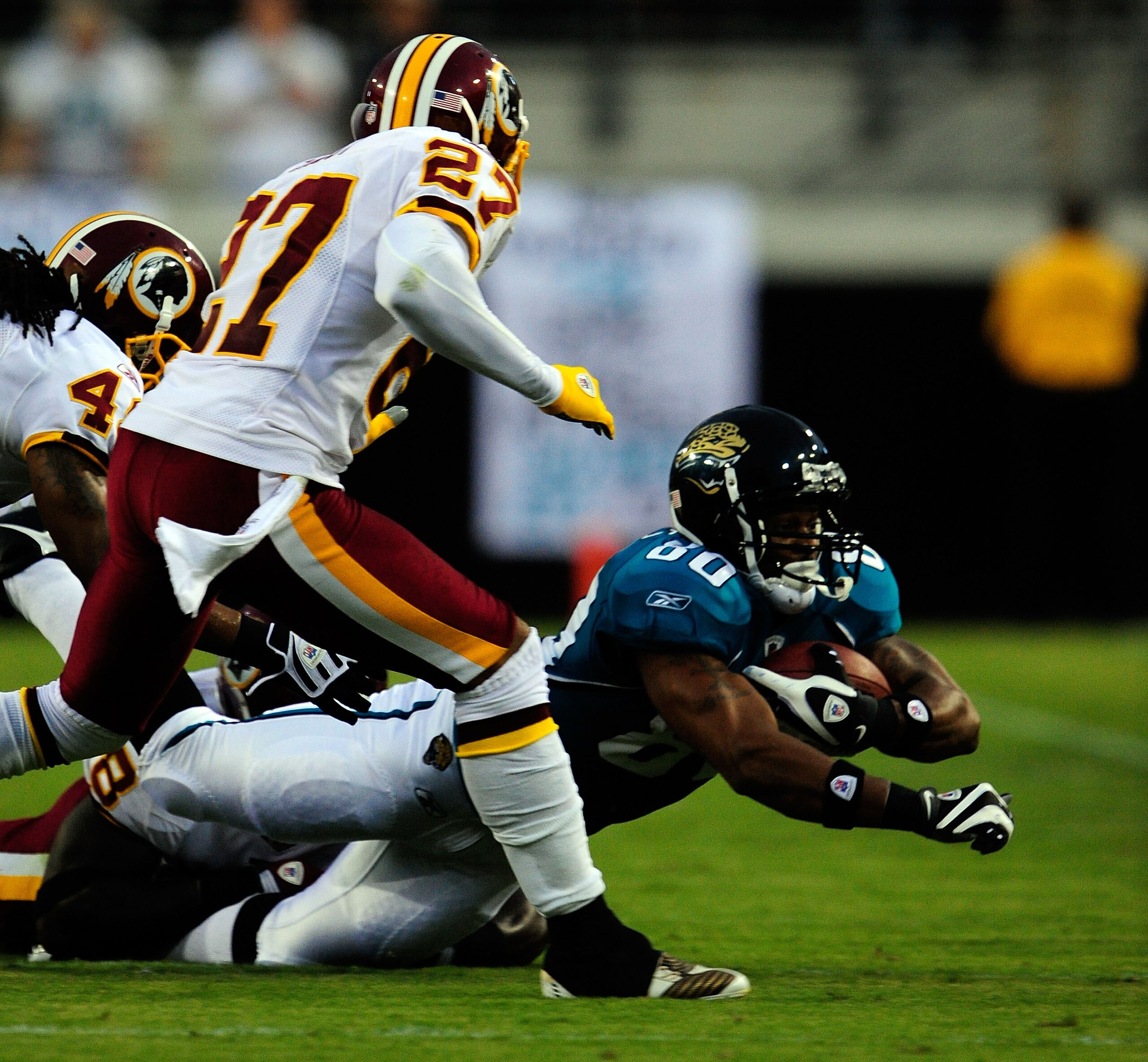JACKSONVILLE, FL - SEPTEMBER 03:  Mike Thomas #80 of the Jacksonville Jaguars rushes for yardage during the game against the Washington Redskins at Jacksonville Municipal Stadium on September 3, 2009 in Jacksonville, Florida.  (Photo by Sam Greenwood/Gett