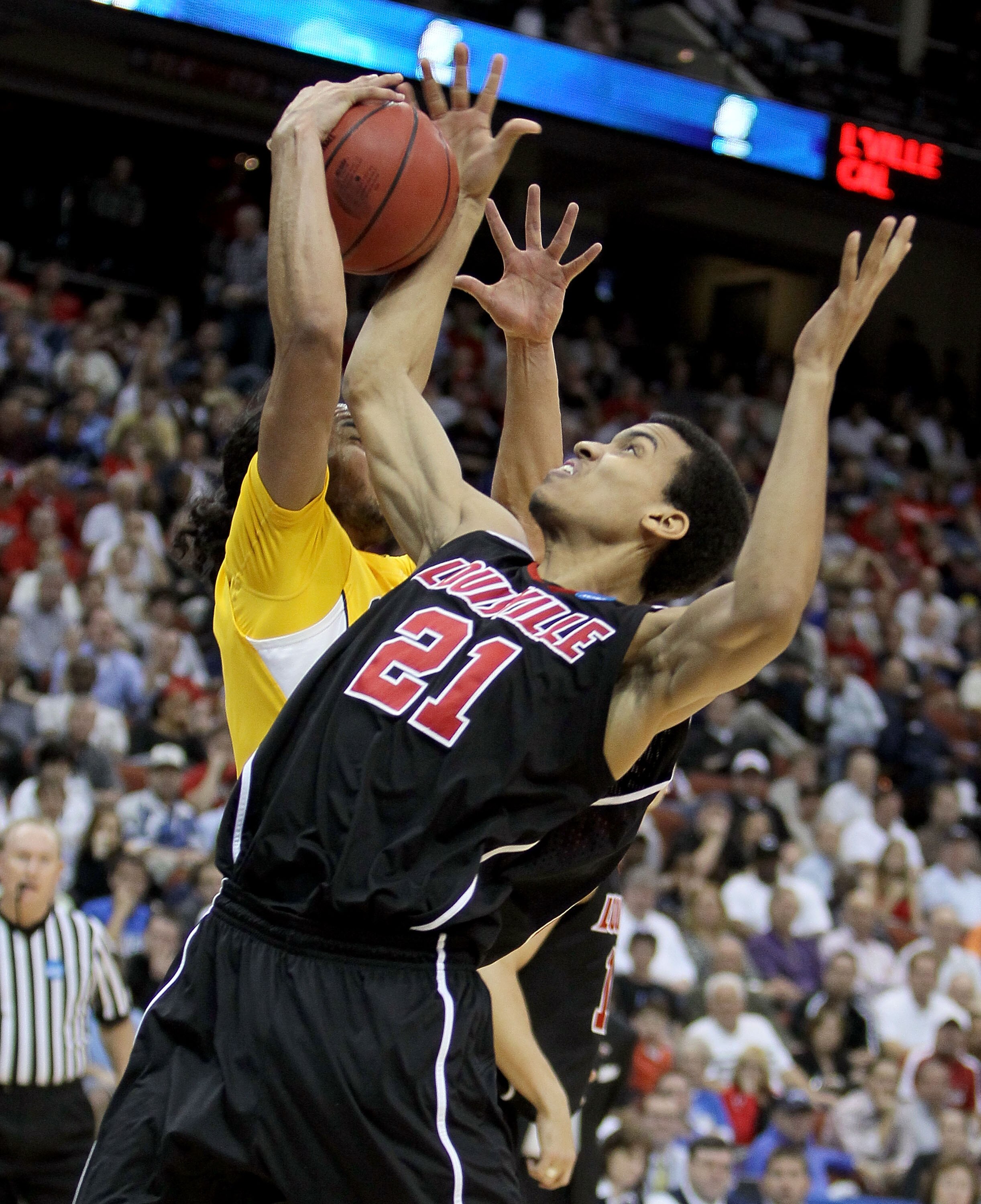 JACKSONVILLE, FL - MARCH 19: Jared Swopshire #21 of the Louisville Cardinals battles with Jorge Gutierrez #2 of the California Golden Bears during the first round of the 2010 NCAA men's basketball tournament at Jacksonville Veteran's Memorial Arena on Mar