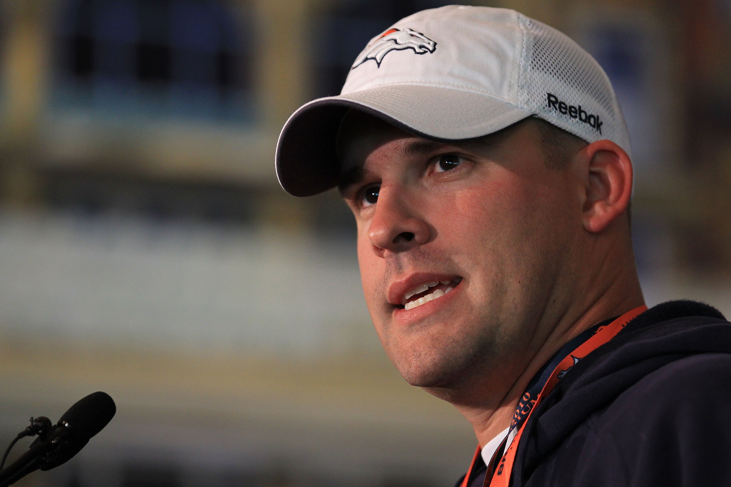 LONDON, ENGLAND - OCTOBER 29:  Head coach of the Denver Broncos Josh McDaniels speaks to the media during a press conference prior to the start of a team training session at The Brit Oval on October 29, 2010 in London, England. The Denver Broncos will pla