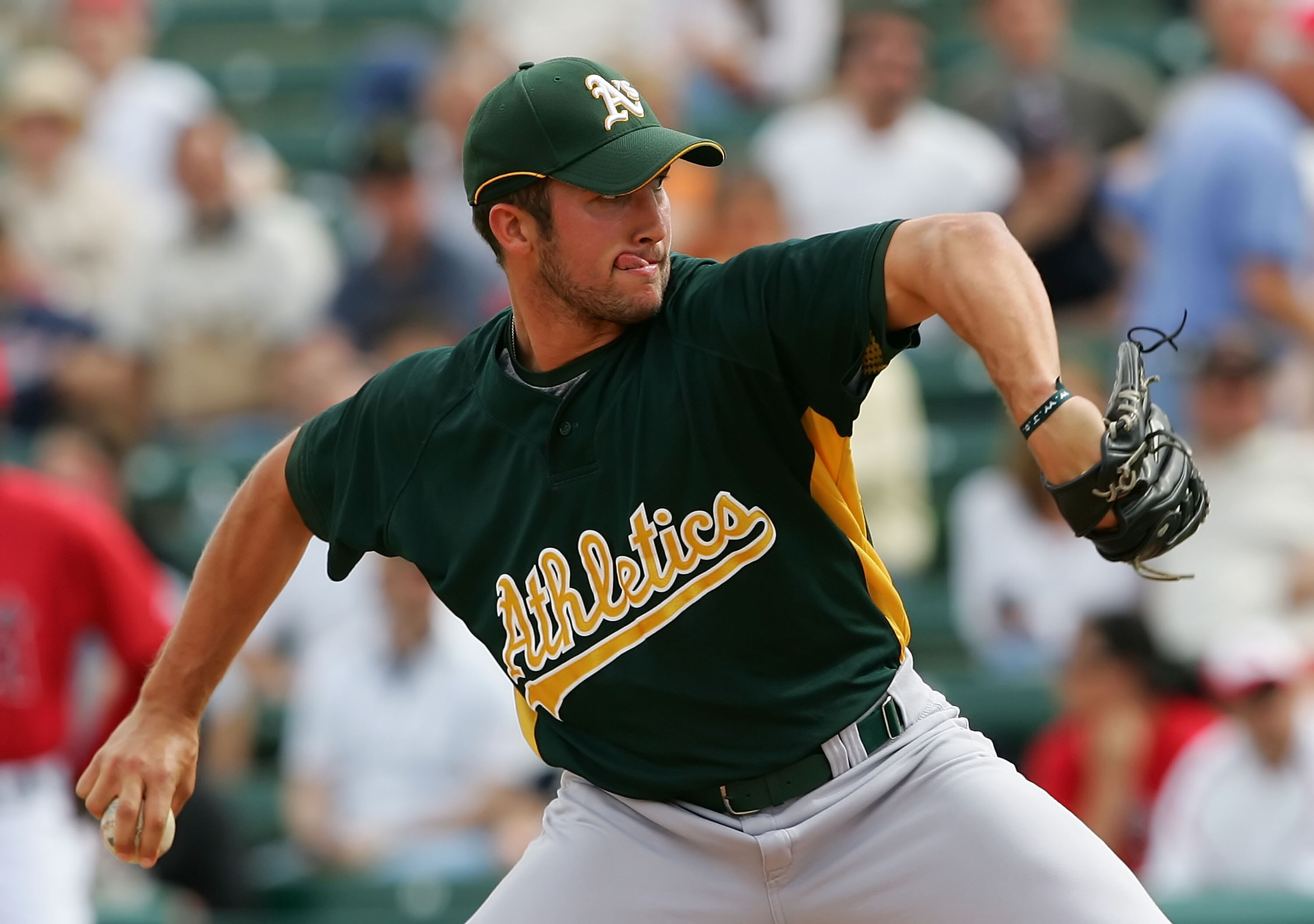TEMPE, AZ - MARCH 05:  Huston Street #20 of the Oakland Athletics pitches against the Los Angeles Angels of Anaheim on March 5, 2007 at Tempe Diablo Stadium in Tempe, Arizona. The A's defeated the Angels 8-7.  (Photo by Lisa Blumenfeld/Getty Images)