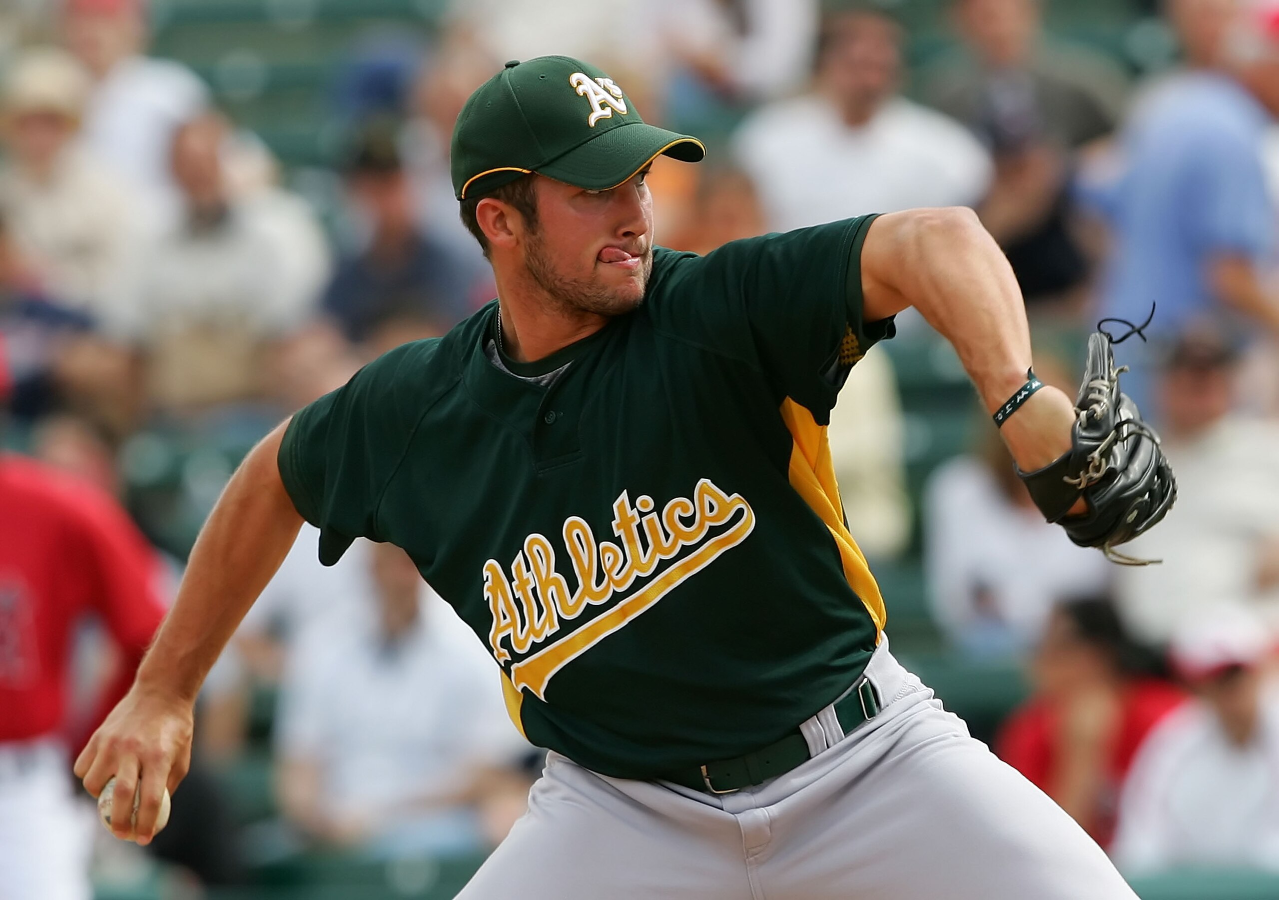 TEMPE, AZ - MARCH 05:  Huston Street #20 of the Oakland Athletics pitches against the Los Angeles Angels of Anaheim on March 5, 2007 at Tempe Diablo Stadium in Tempe, Arizona. The A's defeated the Angels 8-7.  (Photo by Lisa Blumenfeld/Getty Images)