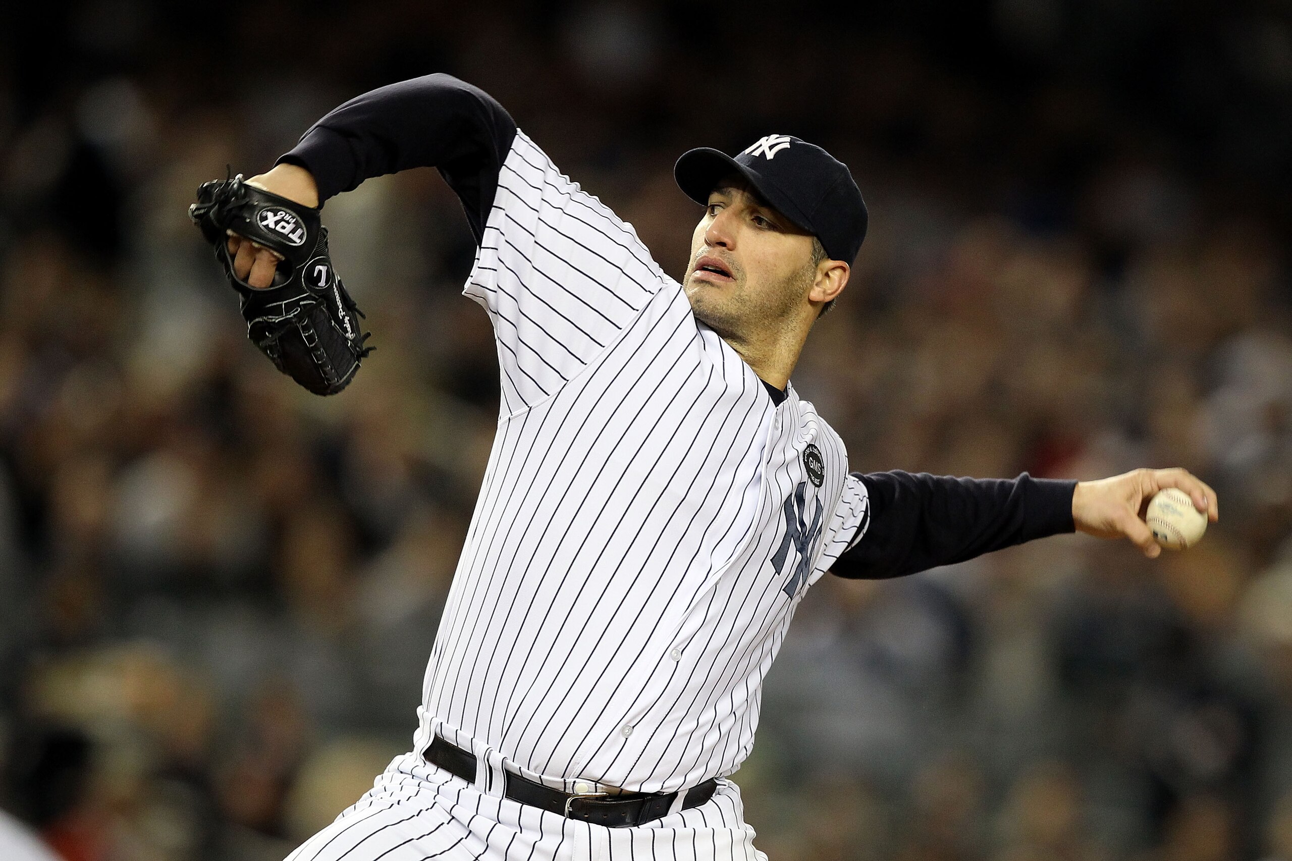 NEW YORK - OCTOBER 18:  Starting pitcher Andy Pettitte #46 of the New York Yankees pitches against the Texas Rangers in Game Three of the ALCS during the 2010 MLB Playoffs at Yankee Stadium on October 18, 2010 in New York, New York.  (Photo by Al Bello/Ge