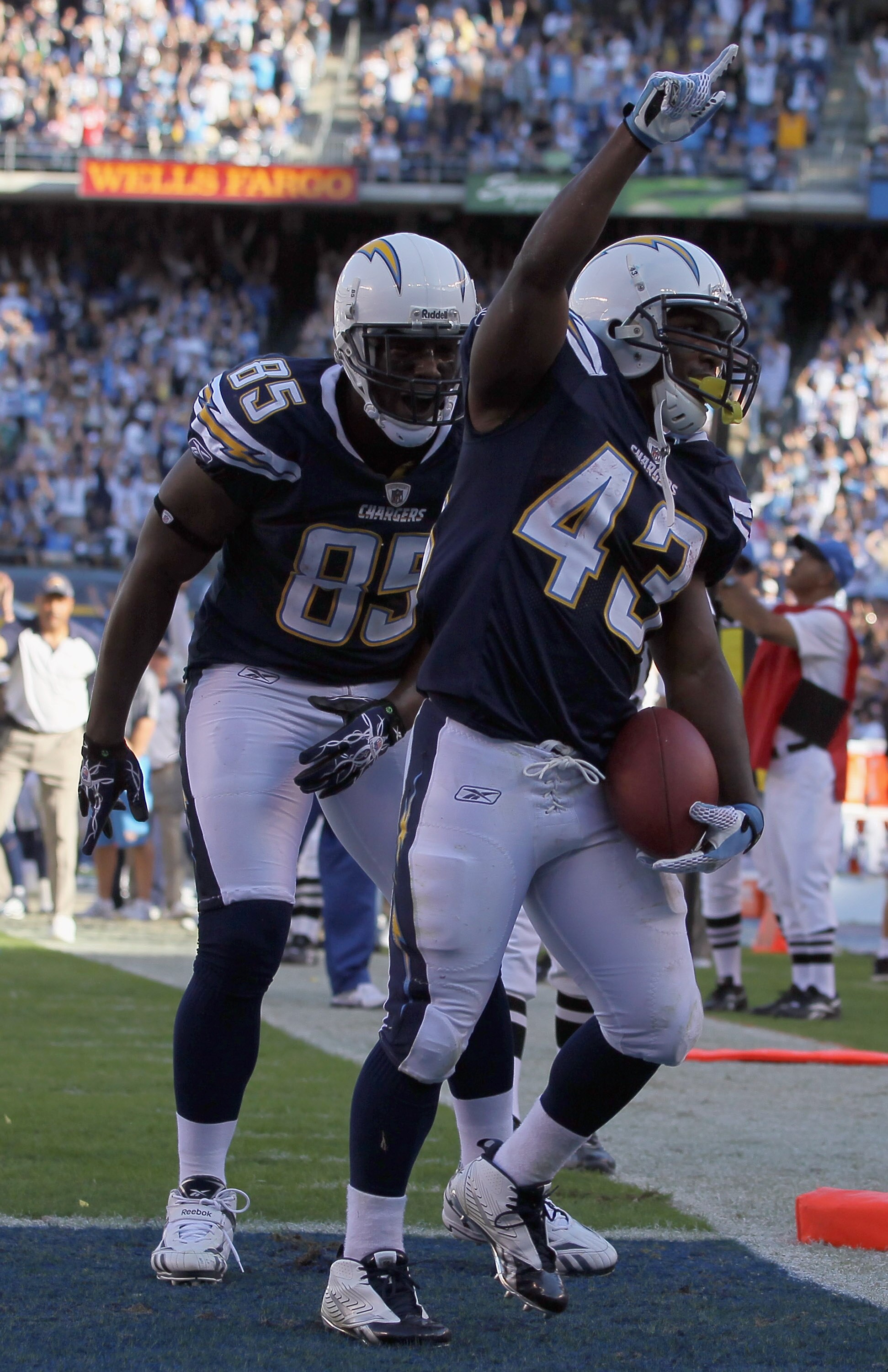 SAN DIEGO - OCTOBER 31:  Tight end Antonio Gates (L) #85 and Darren Sproles #43 of the San Diego Chargers celebrate Sproles' touchdown against the Tennessee Titans in the fourth quarter at Qualcomm Stadium on October 31, 2010 in San Diego, California. The