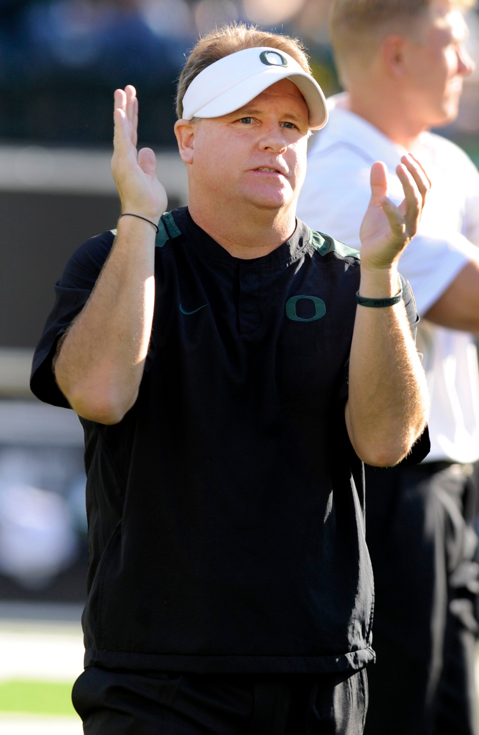 EUGENE, OR - OCTOBER 2: Head coach Chip Kelly of the Oregon Ducks looks encourages his team during warm ups before the game against the Stanford Cardinal at Autzen Stadium on October 2, 2010 in Eugene, Oregon. Oregon won the game 52-31. (Photo by Steve Dy