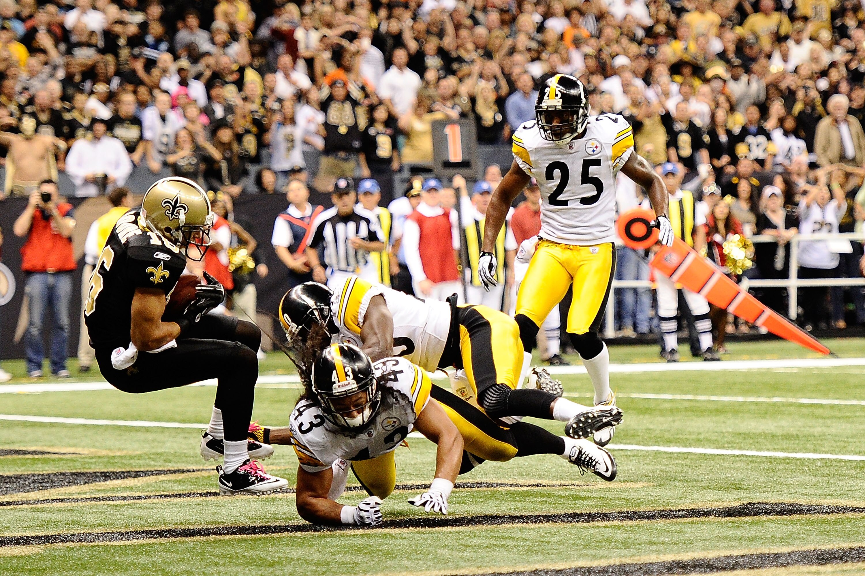 NEW ORLEANS - OCTOBER 31:  Lance Moore #16 of the New Orleans Saints catches a touchdown while Troy Polamalu #41, Bryant McFadden #20, and Ryan Clark #25 of the Pittsburgh Steelers defend at Louisiana Superdome on October 31, 2010 in New Orleans, Louisian