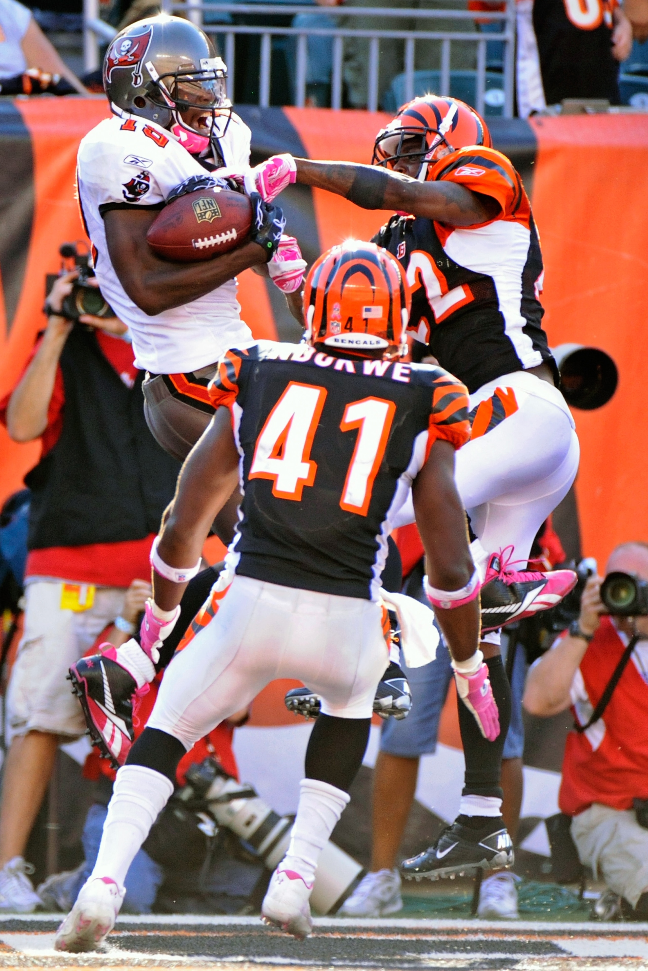 CINCINNATI, OH - OCTOBER 10:  Mike Williams #19 of the Tampa Bay Buccaneers makes a 20-yard touchdown reception as Johnathan Joseph #22 and Chinedum Ndukwe #41 of the Cincinnati Bengals defend at Paul Brown Stadium on October 10, 2010 in Cincinnati, Ohio.