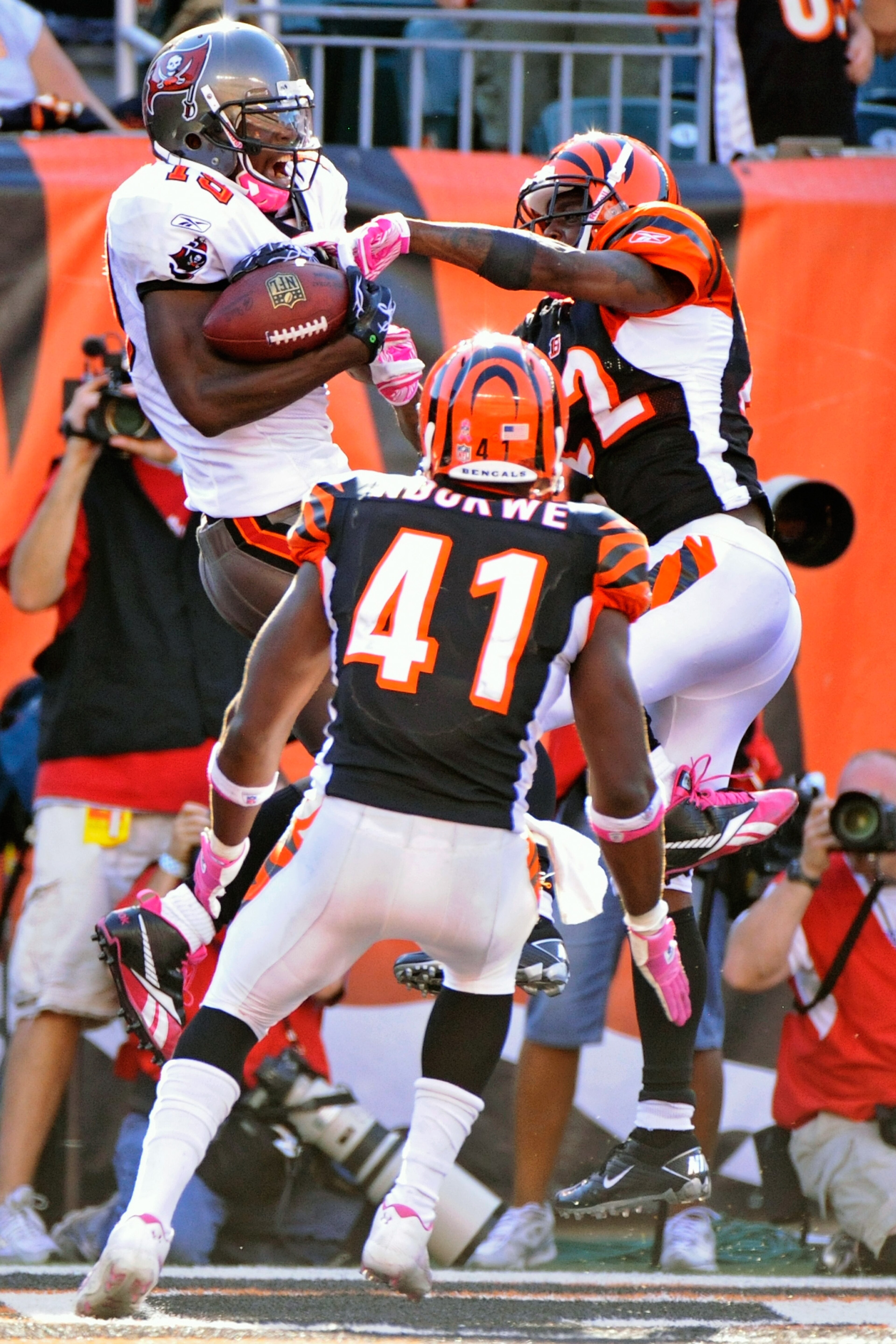 CINCINNATI, OH - OCTOBER 10:  Mike Williams #19 of the Tampa Bay Buccaneers makes a 20-yard touchdown reception as Johnathan Joseph #22 and Chinedum Ndukwe #41 of the Cincinnati Bengals defend at Paul Brown Stadium on October 10, 2010 in Cincinnati, Ohio.
