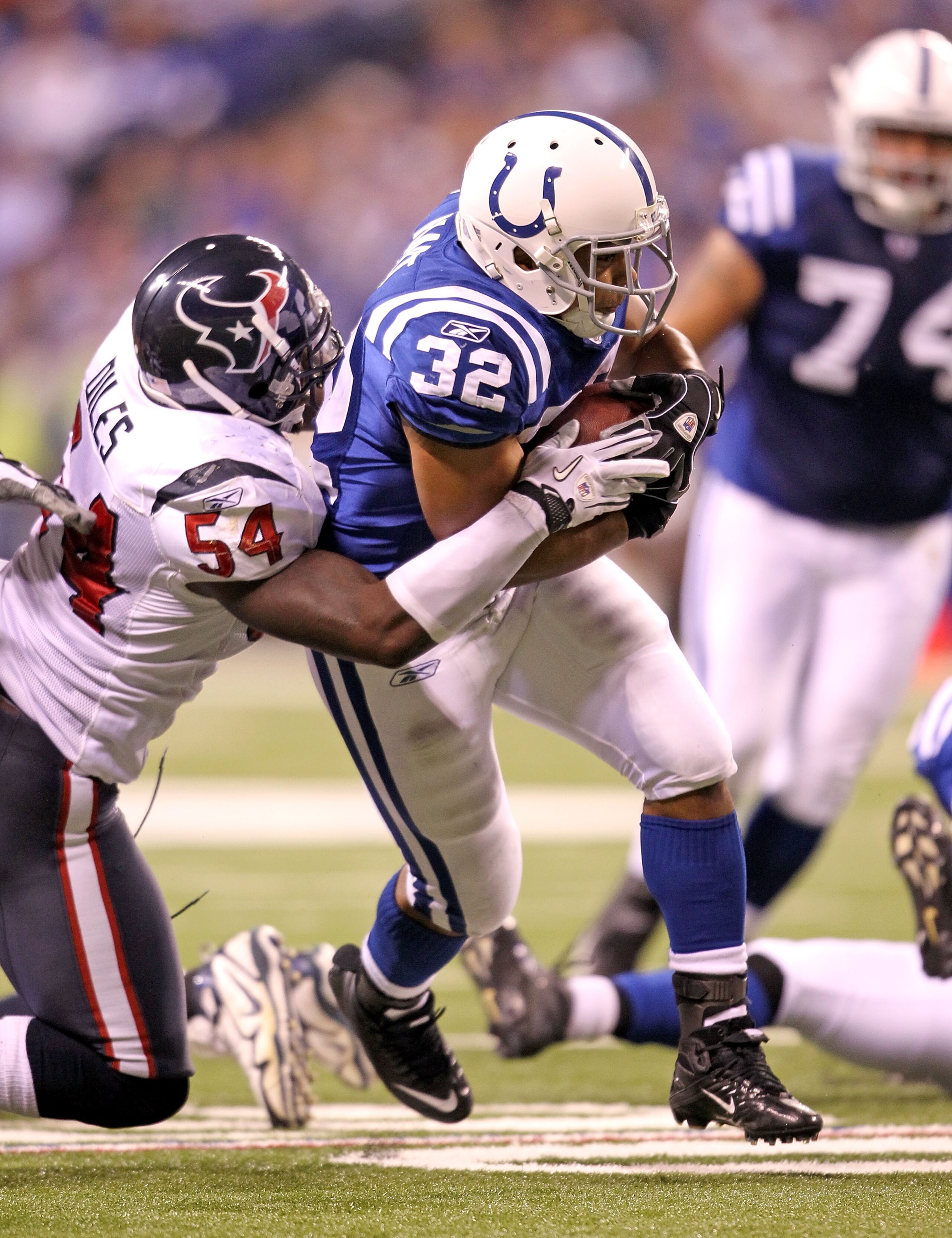 INDIANAPOLIS - NOVEMBER 01:  Mike Hart #32 of Indianapolis Colts runs with the ball while tackled by Zac Diles #54 of the Houston Texans during the NFL game at Lucas Oil Stadium on November 1, 2010 in Indianapolis, Indiana.  (Photo by Andy Lyons/Getty Ima