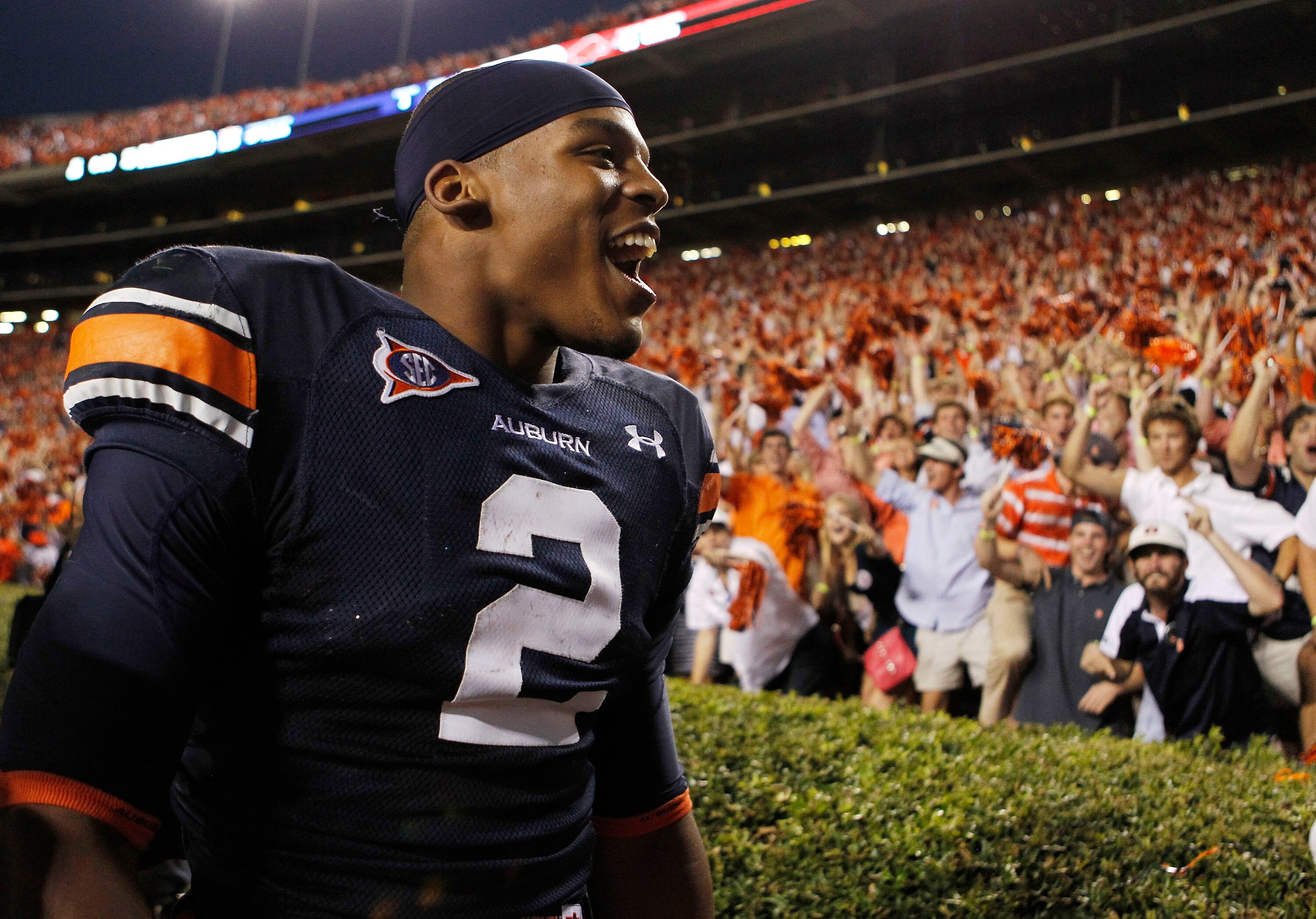 AUBURN, AL - OCTOBER 16:  Quarterback Cam Newton #2 of the Auburn Tigers celebrates with the crowd after the game against the Arkansas Razorbacks at Jordan-Hare Stadium on October 16, 2010 in Auburn, Alabama.  The Tigers beat the Razorbacks 65-43.  (Photo