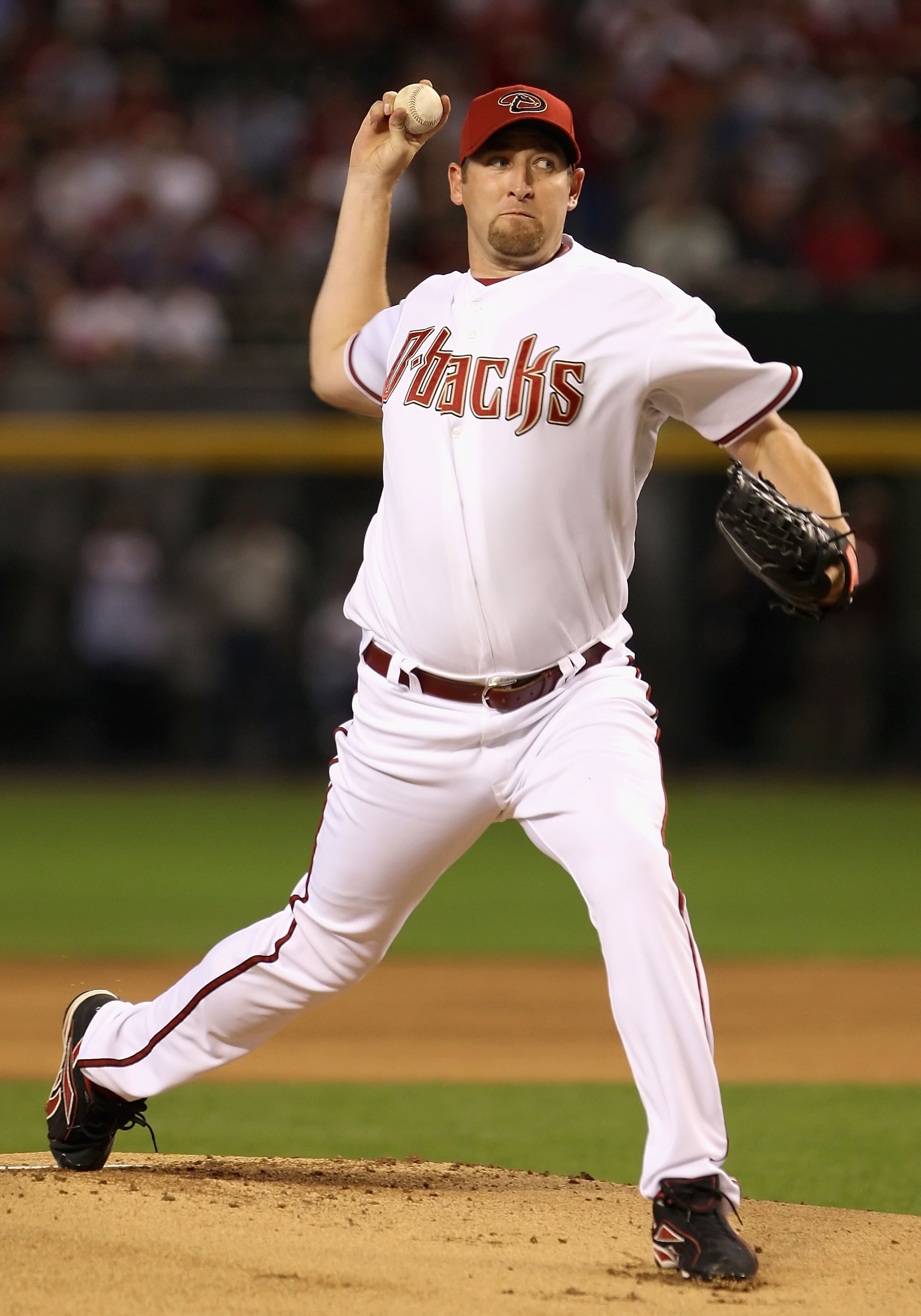 PHOENIX - APRIL 06:  Starting pitcher Brandon Webb #17 of the Arizona Diamondbacks throws the first pitch of the MLB openning day game against the Colorado Rockies at Chase Field on April 6, 2009 in Phoenix, Arizona.  (Photo by Christian Petersen/Getty Im