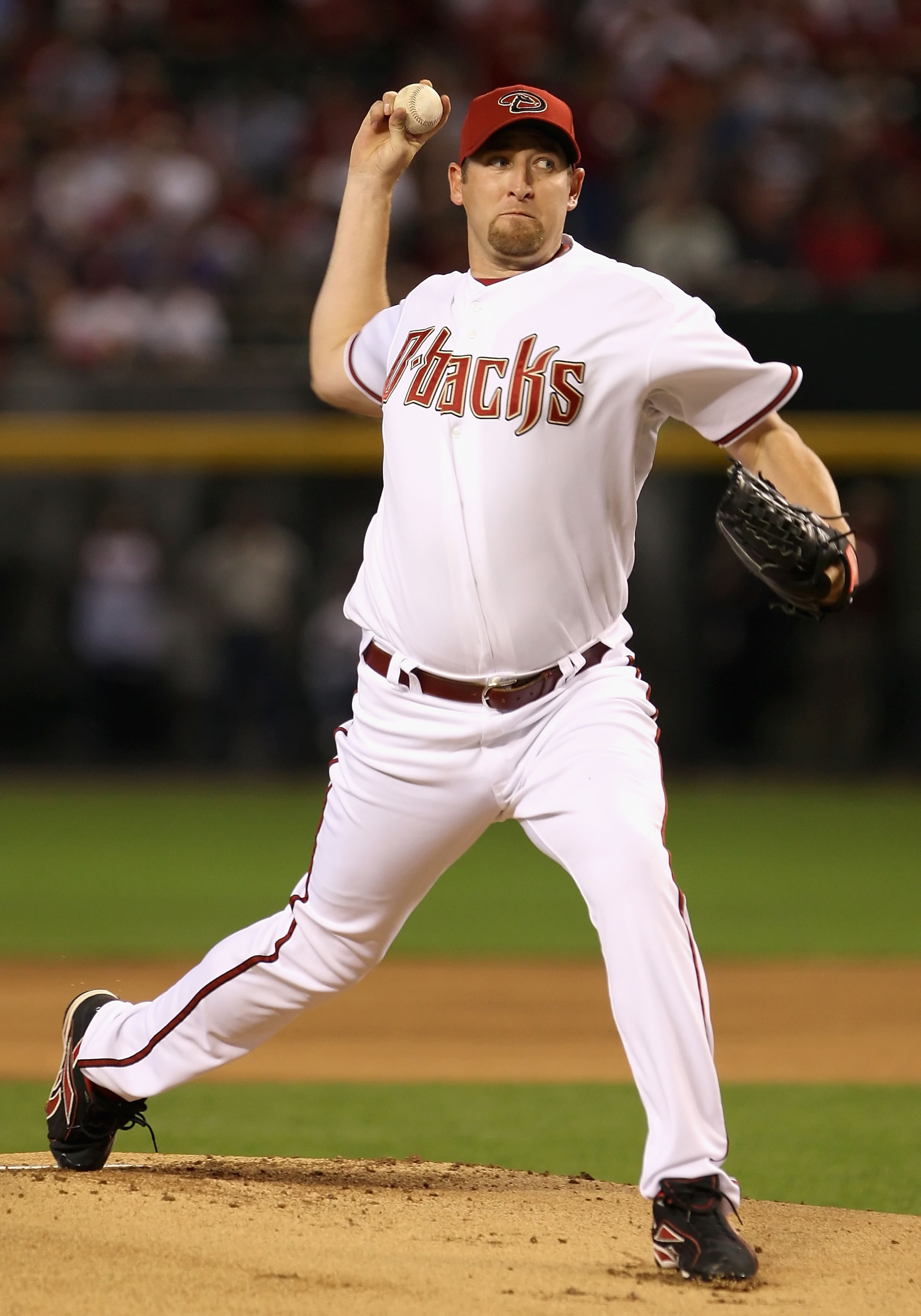 PHOENIX - APRIL 06:  Starting pitcher Brandon Webb #17 of the Arizona Diamondbacks throws the first pitch of the MLB openning day game against the Colorado Rockies at Chase Field on April 6, 2009 in Phoenix, Arizona.  (Photo by Christian Petersen/Getty Im