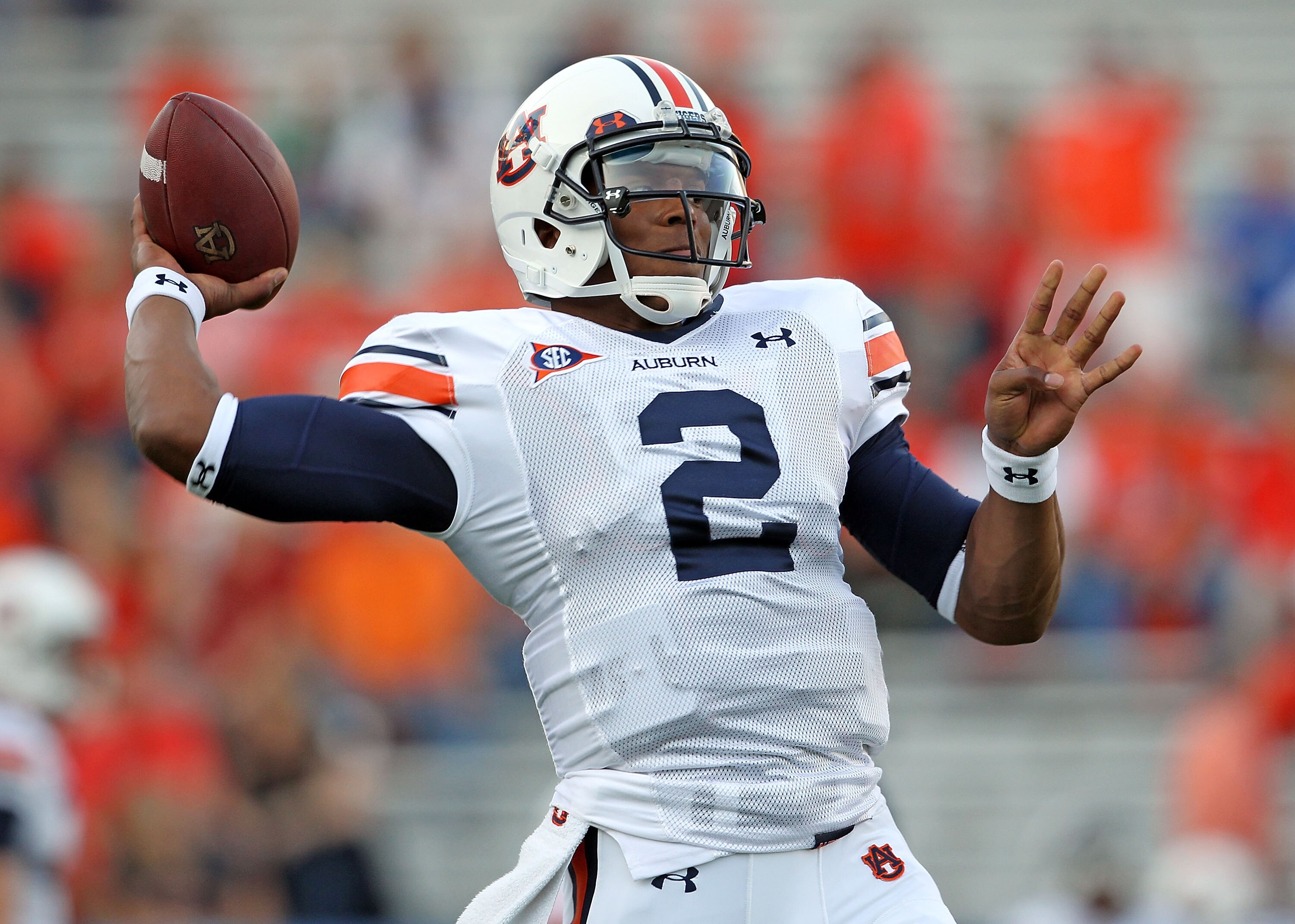 LEXINGTON, KY - OCTOBER 09: Cam Newton #2 of the Auburn Tigers throws a pass as he warms up before the SEC game against the Kentucky Wildcats at Commonwealth Stadium on October 9, 2010 in Lexington, Kentucky.  (Photo by Andy Lyons/Getty Images)
