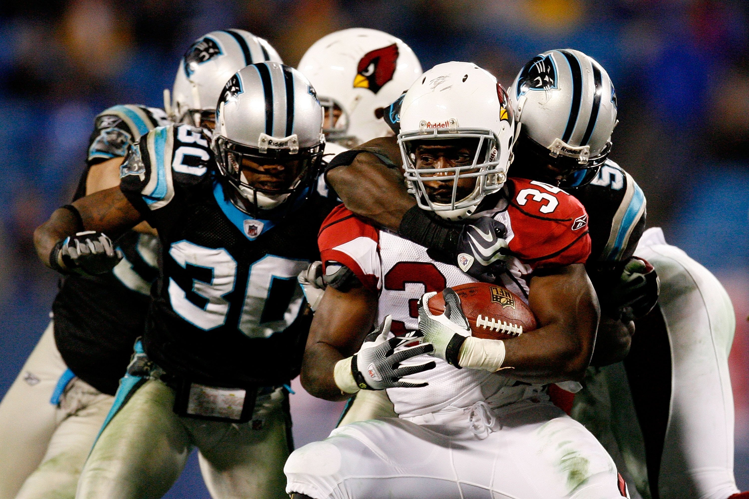 CHARLOTTE, NC - JANUARY 10:  Tim Hightower #34 of the Arizona Cardinals runs the ball against the Charlotte Panthers during the NFC Divisional Playoff Game on January 10, 2009 at Bank of America Stadium in Charlotte, North Carolina.  (Photo by Kevin C. Co