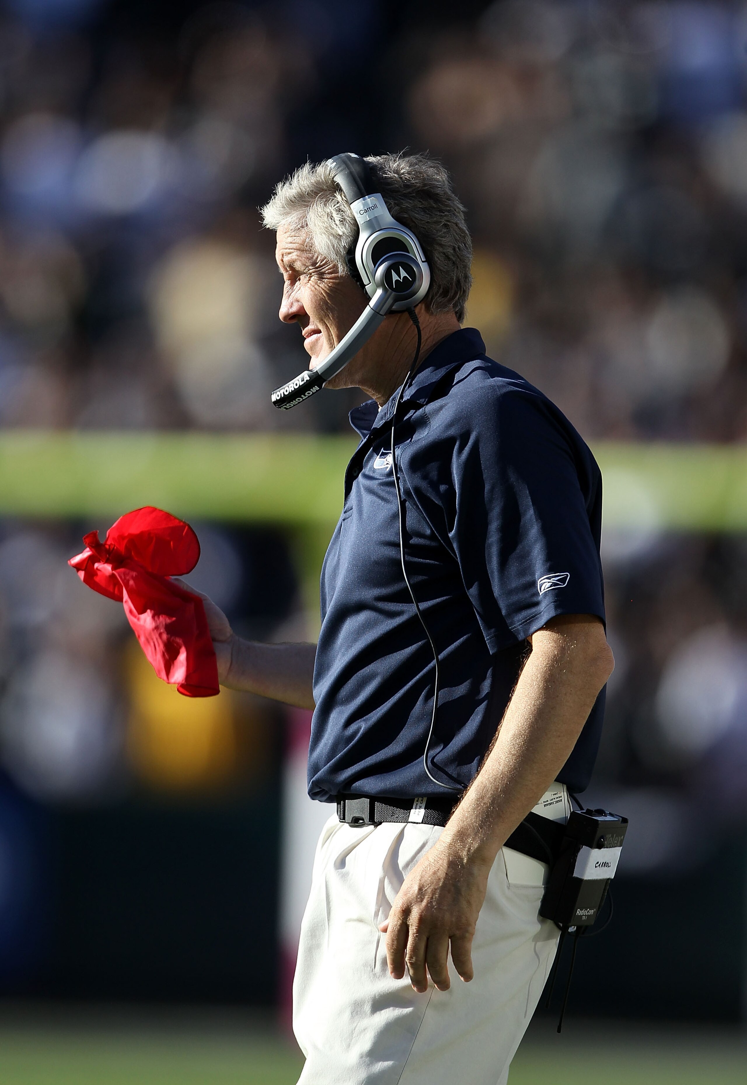 OAKLAND, CA - OCTOBER 31: Head coach Pete Carroll of the Seattle Seahawks gets ready to throw the red flag after Tyvon Branch of the Oakland Raiders made an interception at Oakland-Alameda County Coliseum on October 31, 2010 in Oakland, California. The c OAKLAND, CA - OCTOBER 31: Head coach Pete Carroll of the Seattle Seahawks gets ready to throw the red flag after Tyvon Branch of the Oakland Raiders made an interception at Oakland-Alameda County Coliseum on October 31, 2010 in Oakland, California. The c