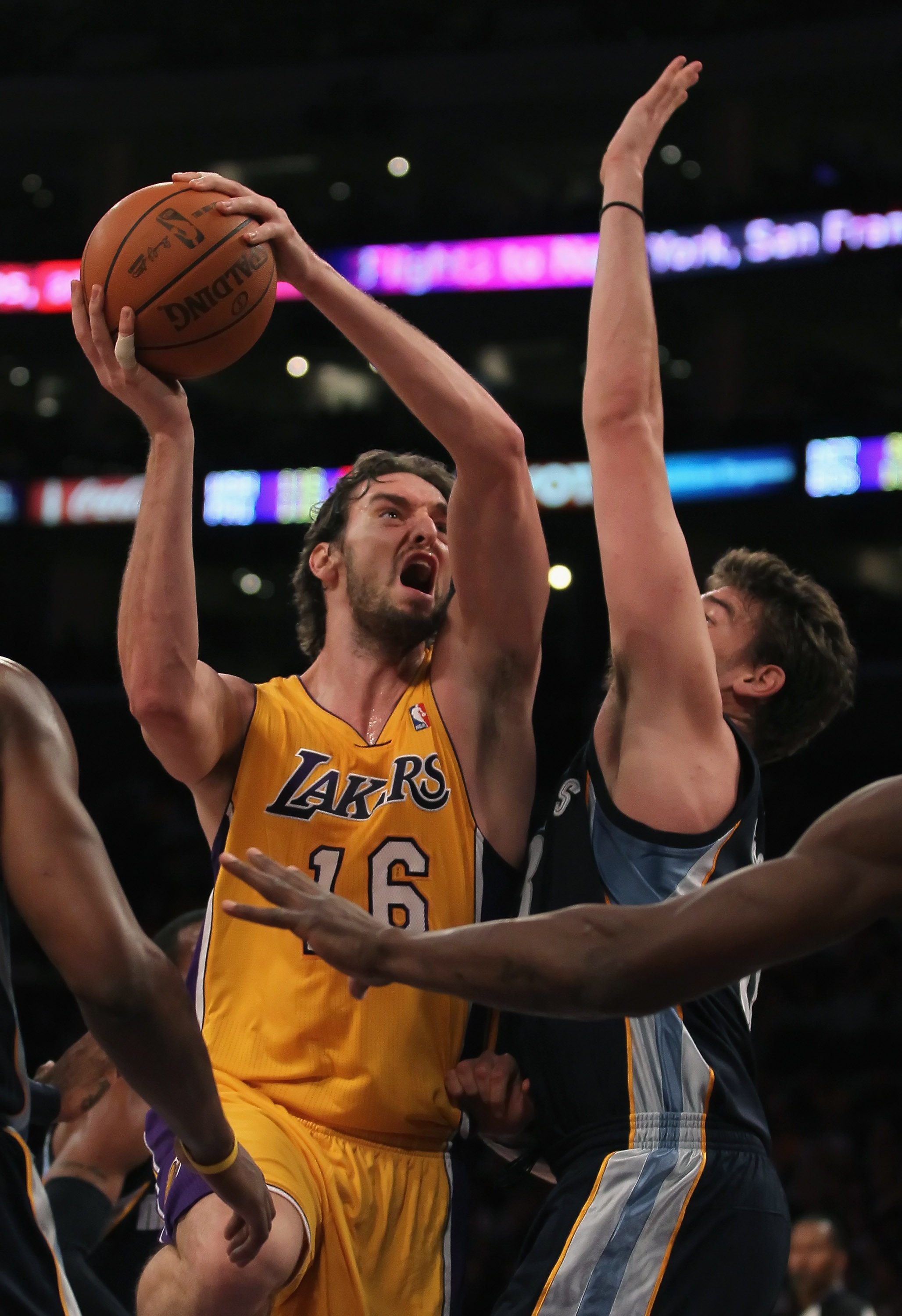 LOS ANGELES, CA - NOVEMBER 02:  Pau Gasol #16 of the Los Angeles Lakers drives over Marc Gasol #33 of the Memphis Grizzlies during the first quarter at Staples Center on November 2, 2010 in Los Angeles, California. The Lakers defeated the Grizzlies 124-10