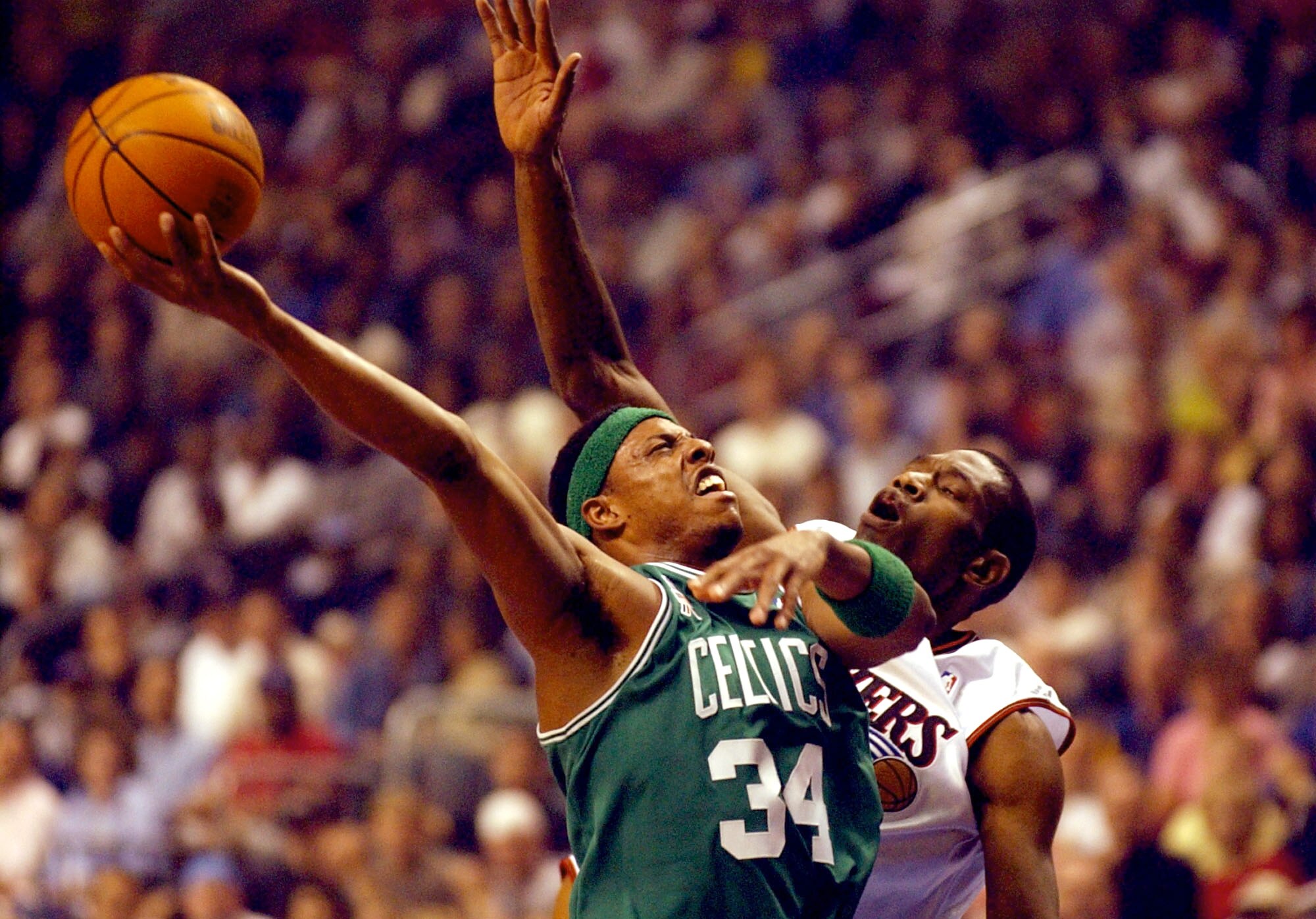 PHILADELPHIA-MAY 1: Paul Pierce #34 of the Boston Celtics looses control of a shot under the defense of Dikembe Mutombo #55 of the Philadelphia 76ers during game 4 of the Eastern Conference quarterfinal series during the 2002 NBA Playoffs at the First Uni