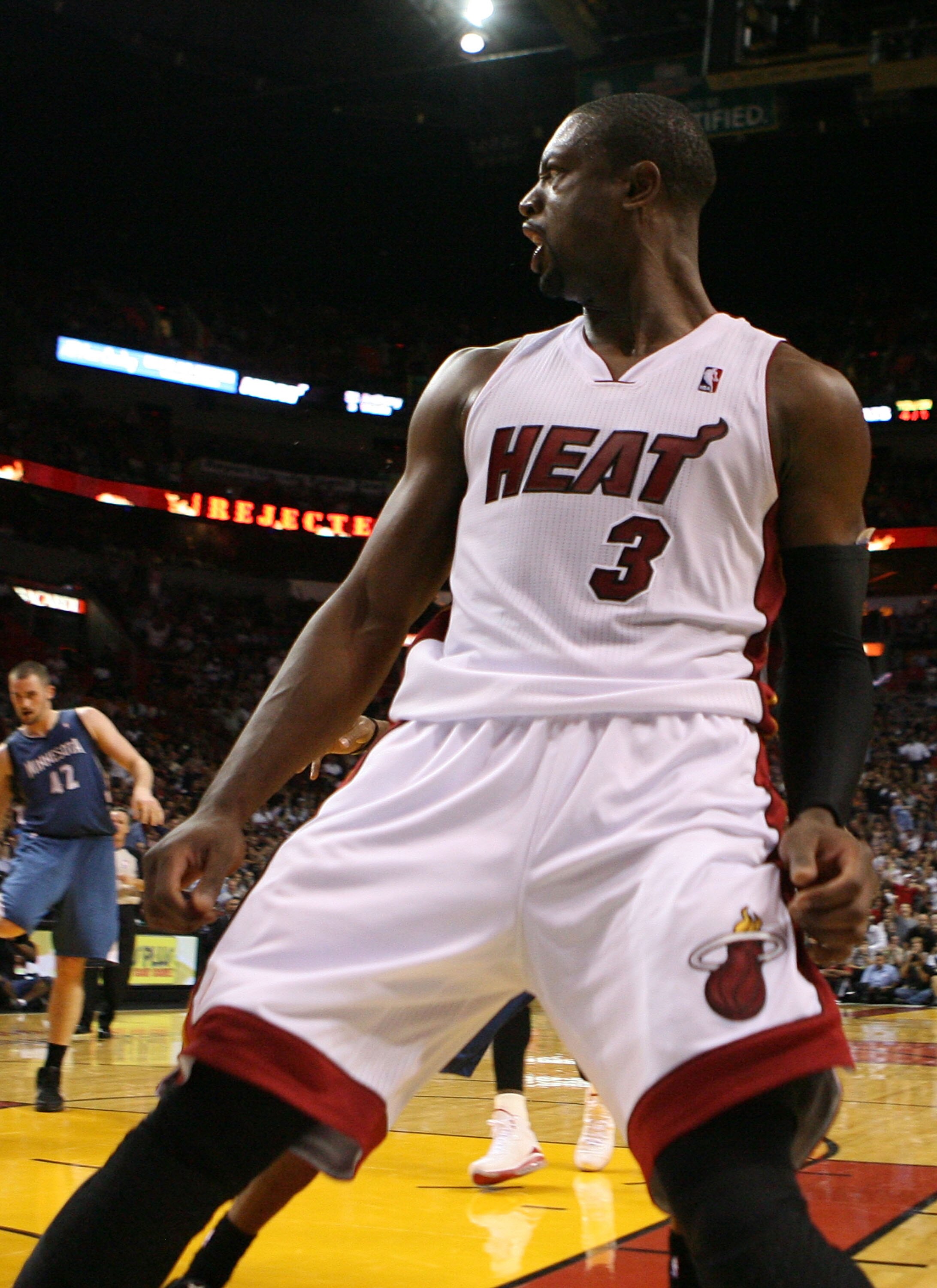 MIAMI - NOVEMBER 02:  Guard Dwyane Wade #3 of the Miami Heat celebrates a dunk against the Minnesota Wolves at American Airlines Arena on November 2, 2010 in Miami, Florida. NOTE TO USER: User expressly acknowledges and agrees that, by downloading and or 
