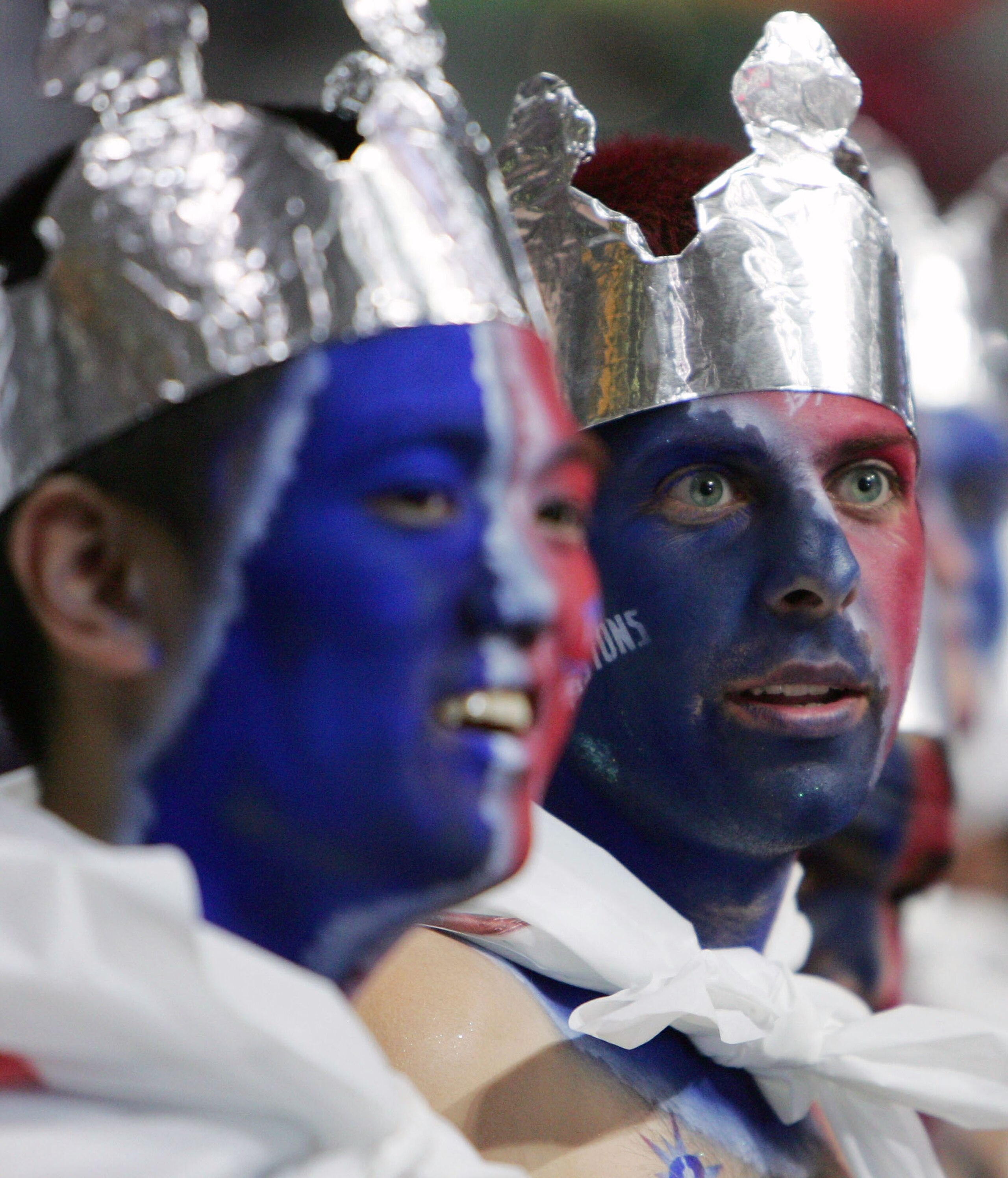 AUBURN HILLS, MI - JUNE 15:  Detroit Pistons fans dawning face paint and foil crowns watch warm-ups before the start of game five of the 2004 NBA Finals between the Pistons and Los Angeles Lakers on June 15, 2004 at The Palace of Auburn Hills in Auburn Hi