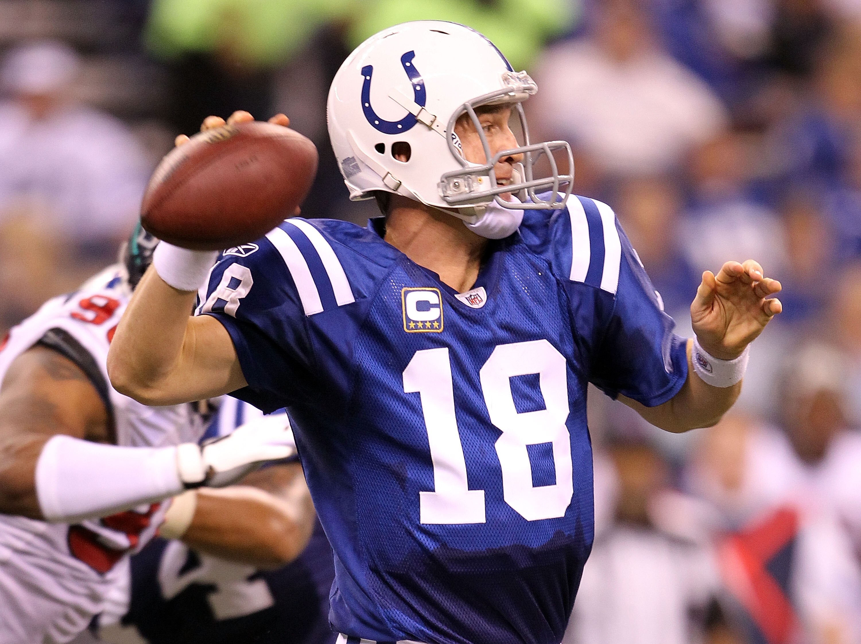 INDIANAPOLIS - NOVEMBER 01:  Peyton Manning #18 of Indianapolis Colts throws a pass during the NFL game against the Houston Texans  at Lucas Oil Stadium on November 1, 2010 in Indianapolis, Indiana.  (Photo by Andy Lyons/Getty Images)