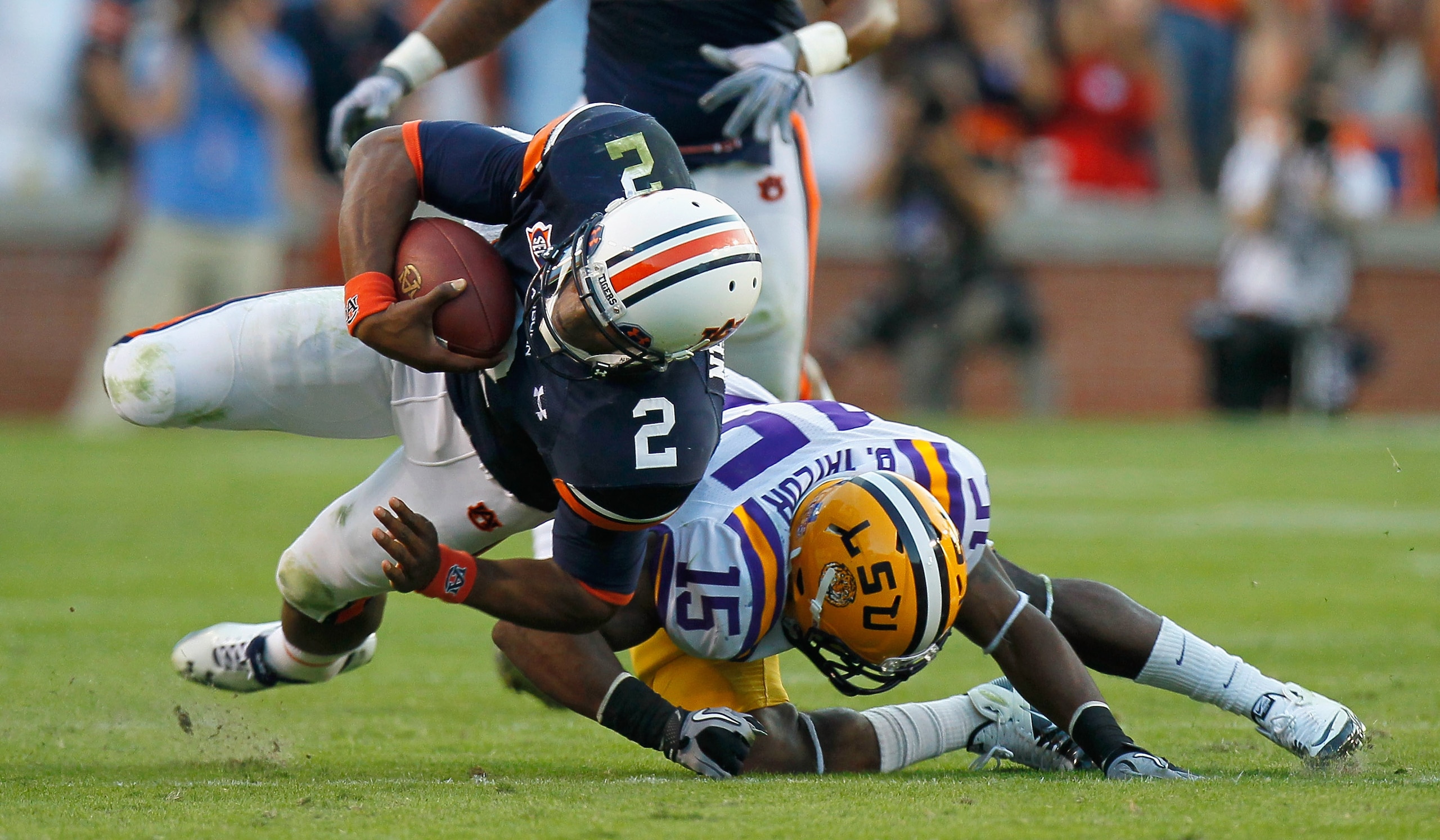 AUBURN, AL - OCTOBER 23:  Quarterback Cameron Newton #2 of the Auburn Tigers is tackled by Brandon Taylor #15 of the LSU Tigers at Jordan-Hare Stadium on October 23, 2010 in Auburn, Alabama.  (Photo by Kevin C. Cox/Getty Images)