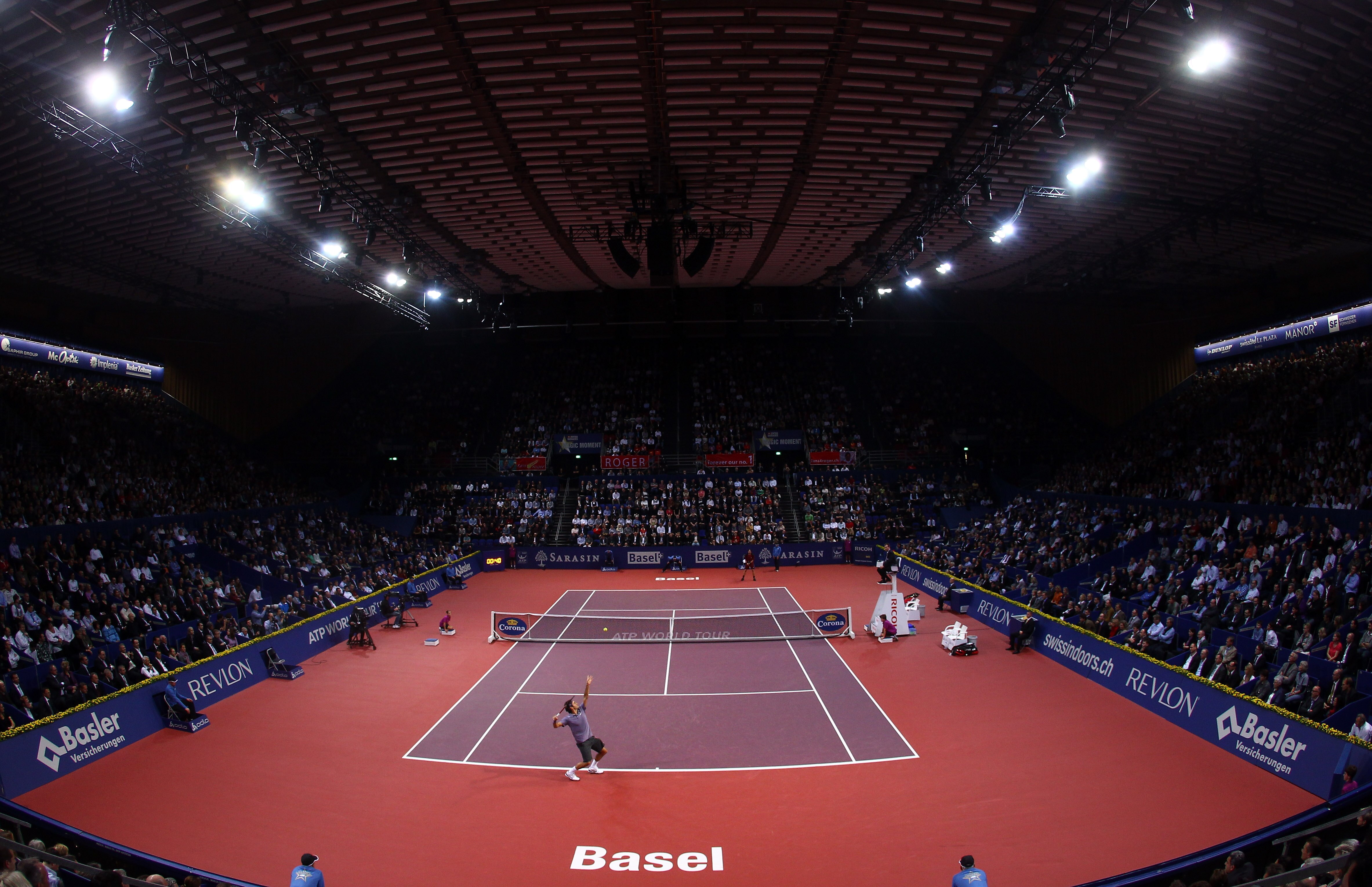 BASEL, SWITZERLAND - NOVEMBER 03:  A general view of Roger Federer of Switzerland serving to Janko Tipsarevic of Serbia during Day Three of the Davidoff Swiss Indoors Tennis at St Jakobshalle on November 3, 2010 in Basel, Switzerland.  (Photo by Julian Fi