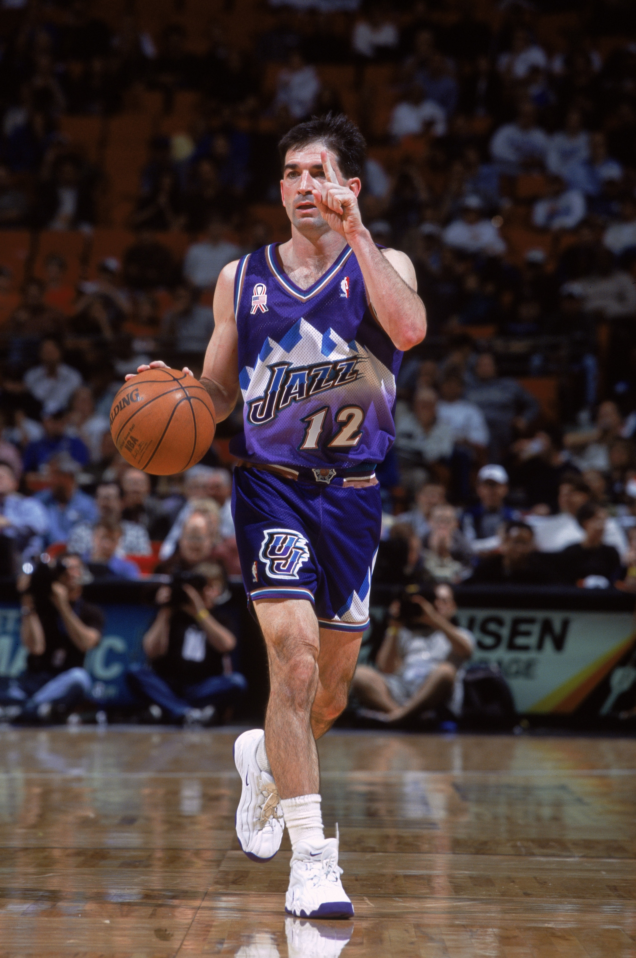 19 Dec 2001: Point guard John Stockton #12 of the Utah Jazz dribbles the ball during the NBA game against the Orlando Magic at the TD Waterhouse Centre in Orlando, Florida. The Magic defeated the Jazz 98-90. Mandatory Credit: Andy Lyons/Getty Images 19 Dec 2001: Point guard John Stockton #12 of the Utah Jazz dribbles the ball during the NBA game against the Orlando Magic at the TD Waterhouse Centre in Orlando, Florida. The Magic defeated the Jazz 98-90. Mandatory Credit: Andy Lyons/Getty Images
