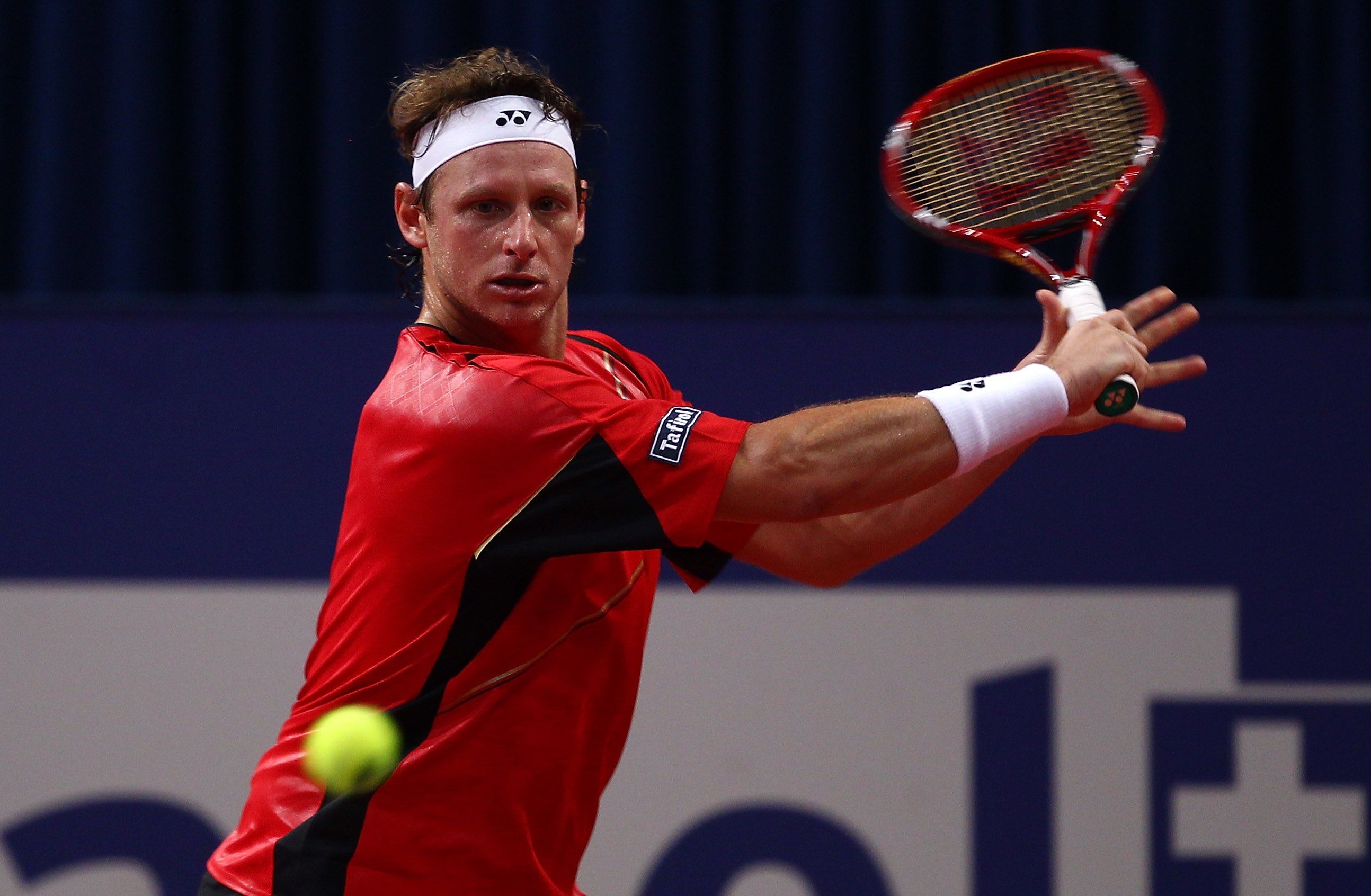 BASEL, SWITZERLAND - NOVEMBER 04:  David Nalbandian of Argentina in action in his match against Marin Cilic of Croatia during Day Four of the Davidoff Swiss Indoors Tennis at St Jakobshalle on November 4, 2010 in Basel, Switzerland.  (Photo by Julian Finn