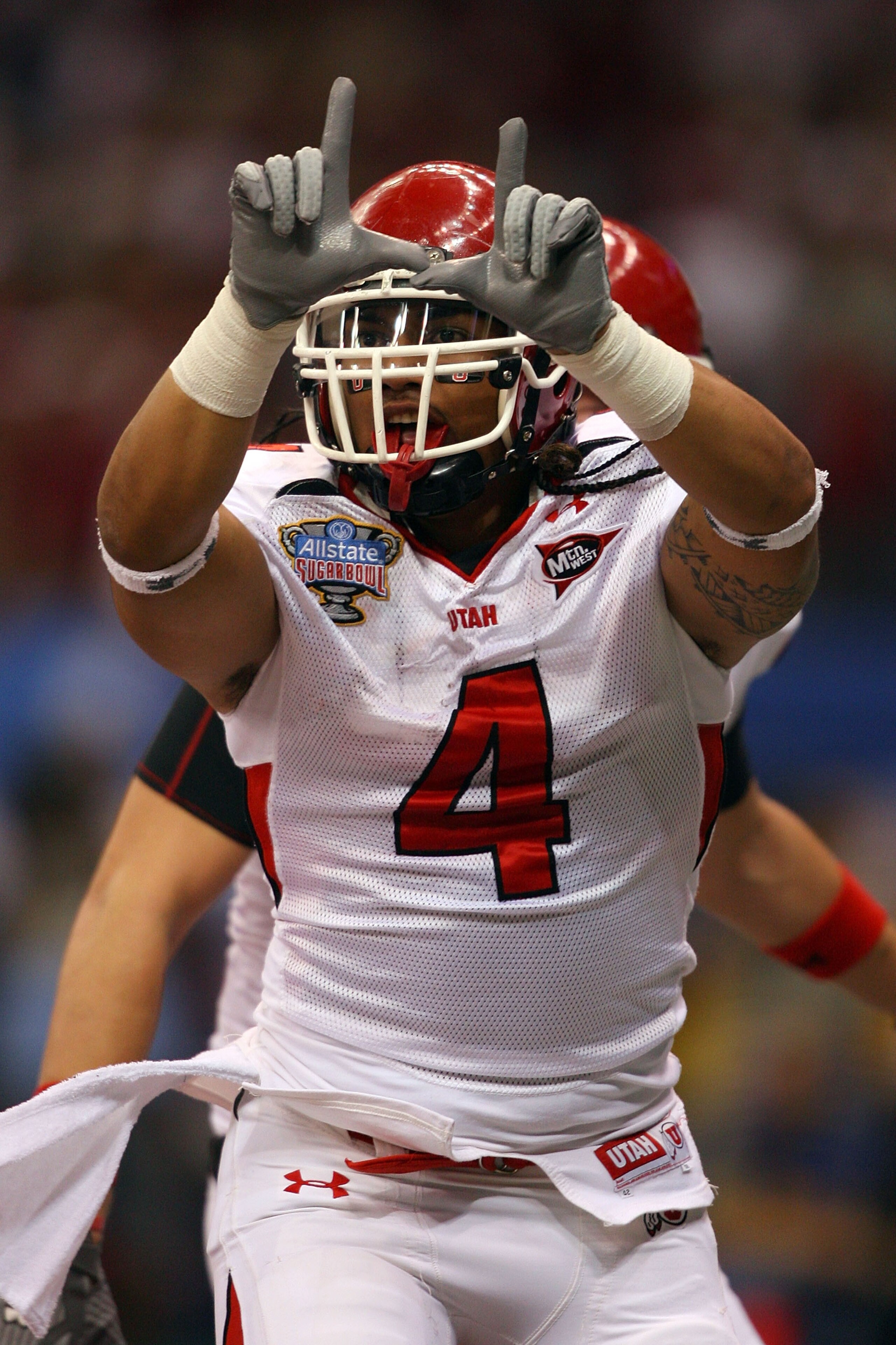 NEW ORLEANS - JANUARY 02:  Matt Asiata #4 of the Utah Utes reacts after he scores a two-yard touchdown in the first quarter against the Alabama Crimson Tide during the 75th Allstate Sugar Bowl at the Louisiana Superdome on January 2, 2009 in New Orleans,