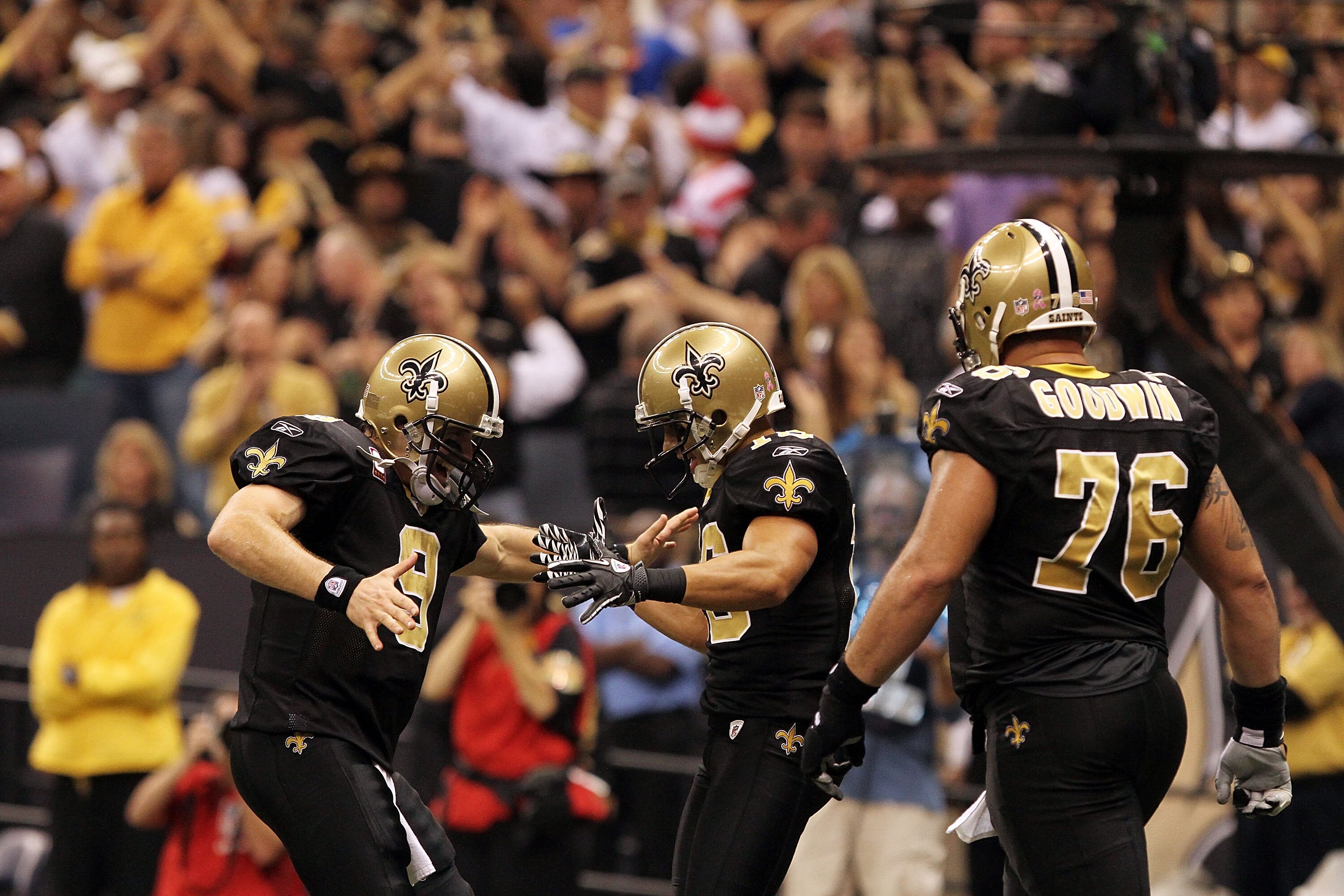 NEW ORLEANS, LA - OCTOBER 31: Drew Brees #9 and Lance Moore #16 of the New Orleans Saints celebrate a touchdown during the game against the Pittsburgh Steelers at the Louisiana Superdome on October 31, 2010 in New Orleans, Louisiana. (Photo by Matthew Sha