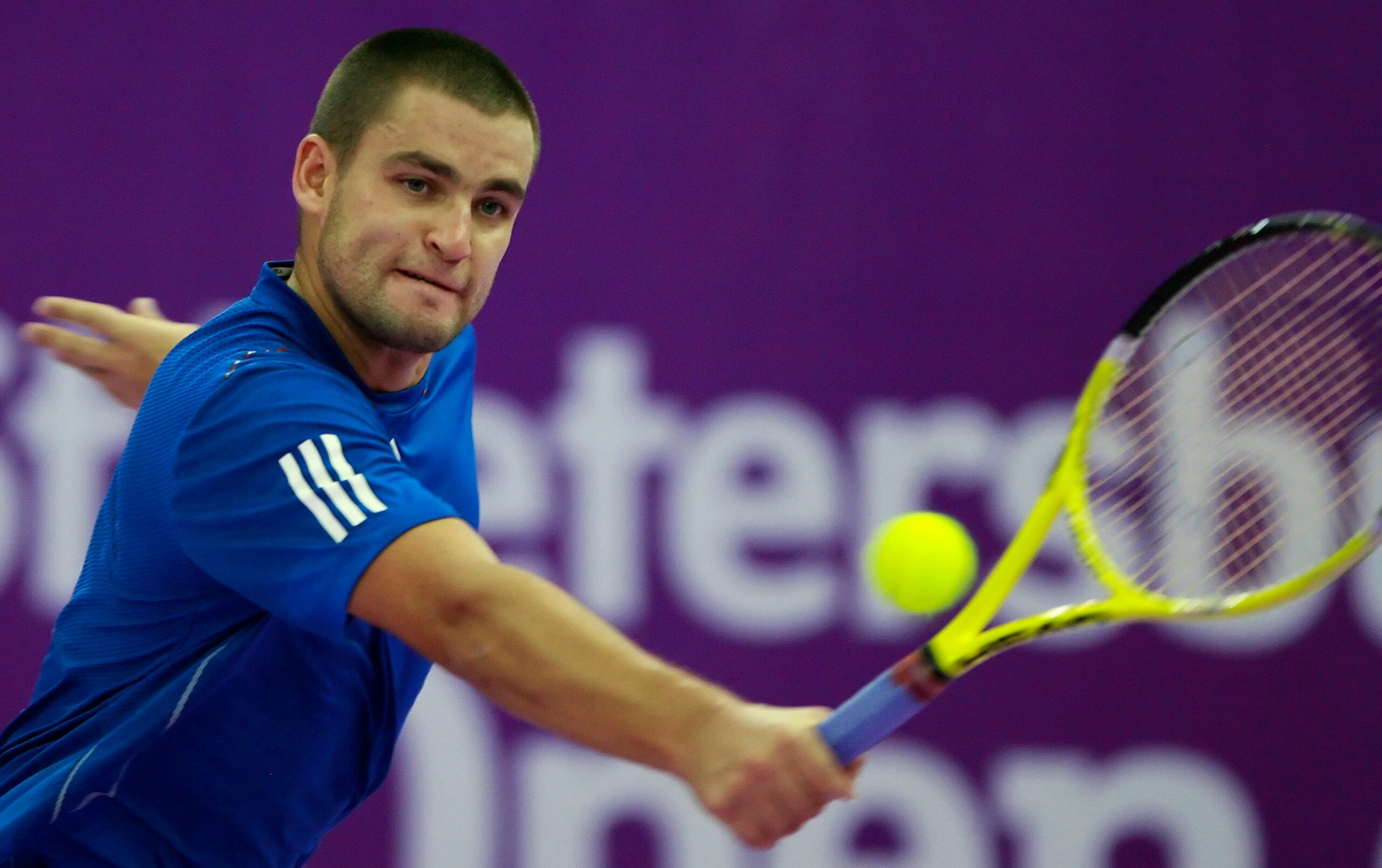 ST. PETERSBURG, RUSSIA - OCTOBER 31: Mikhail Youzhny of Russia plays against Mikhail Kukushkin of Kazakhstan during the singles final of the International Tennis Tournamen St. Petersburg Open 2010 at the Petersburgsky Sports Complex on October 31, 2010 in