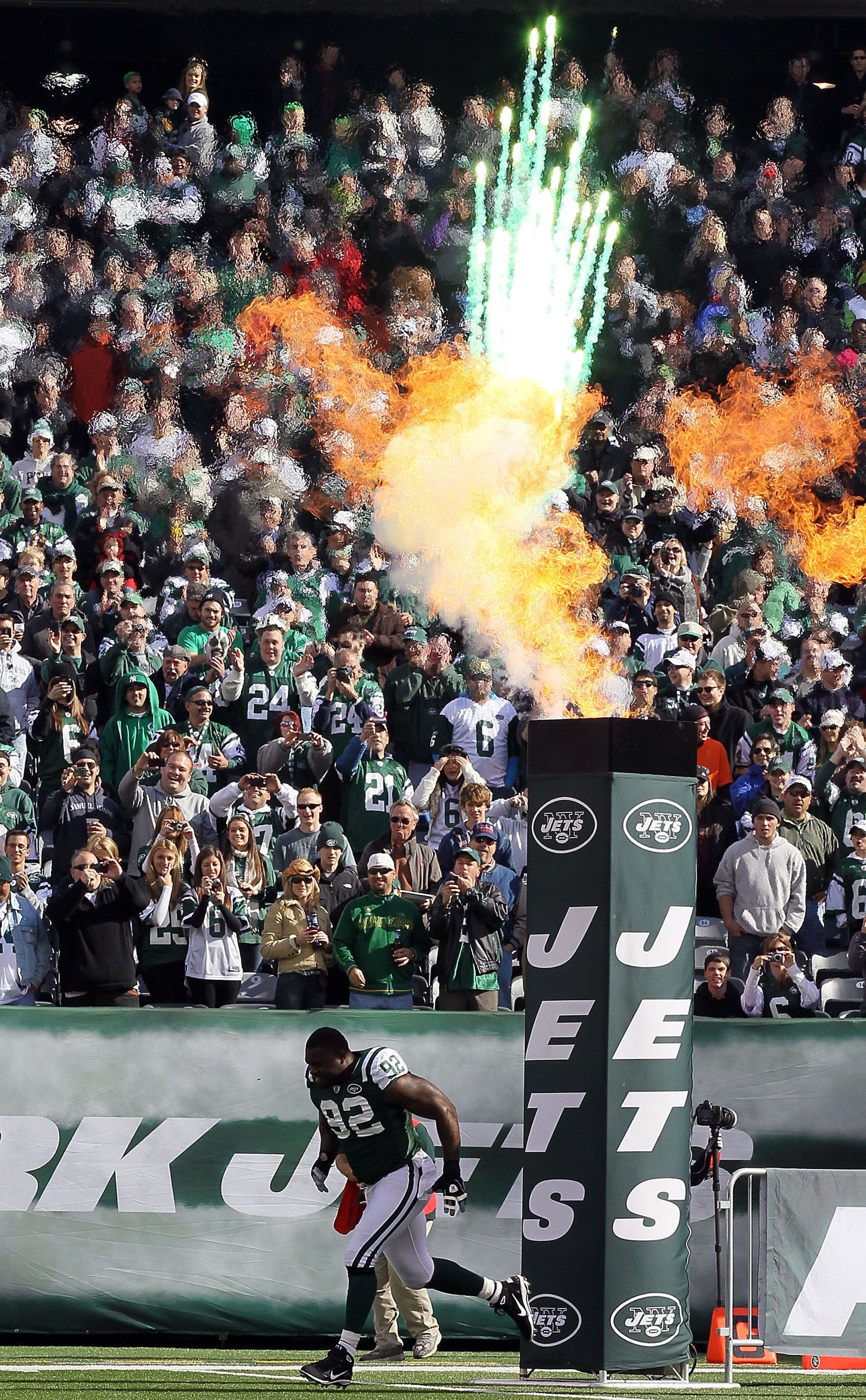EAST RUTHERFORD, NJ - OCTOBER 31:  Shaun Ellis #92 of the New York Jets is introduced prior to the game against the Green Bay Packers on October 31, 2010 at the New Meadowlands Stadium in East Rutherford, New Jersey.  (Photo by Jim McIsaac/Getty Images)