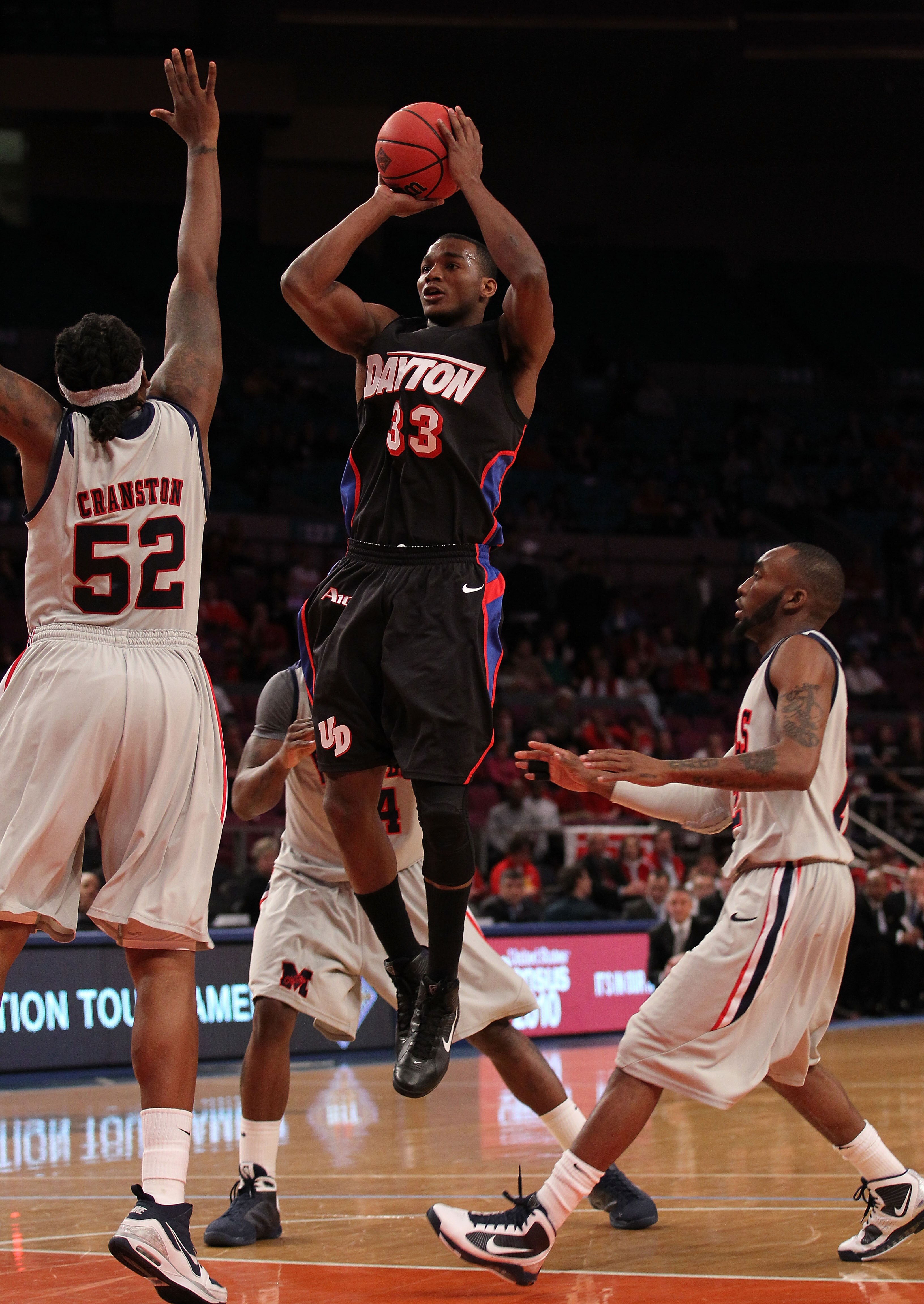 NEW YORK - MARCH 30:  Chris Wright #33 of the Dayton Flyers shoots a shot over DeAundre Cranston #52 of Ole Miss during their semi final at Madison Square Garden on March 30, 2010 in New York, New York.  (Photo by Nick Laham/Getty Images)