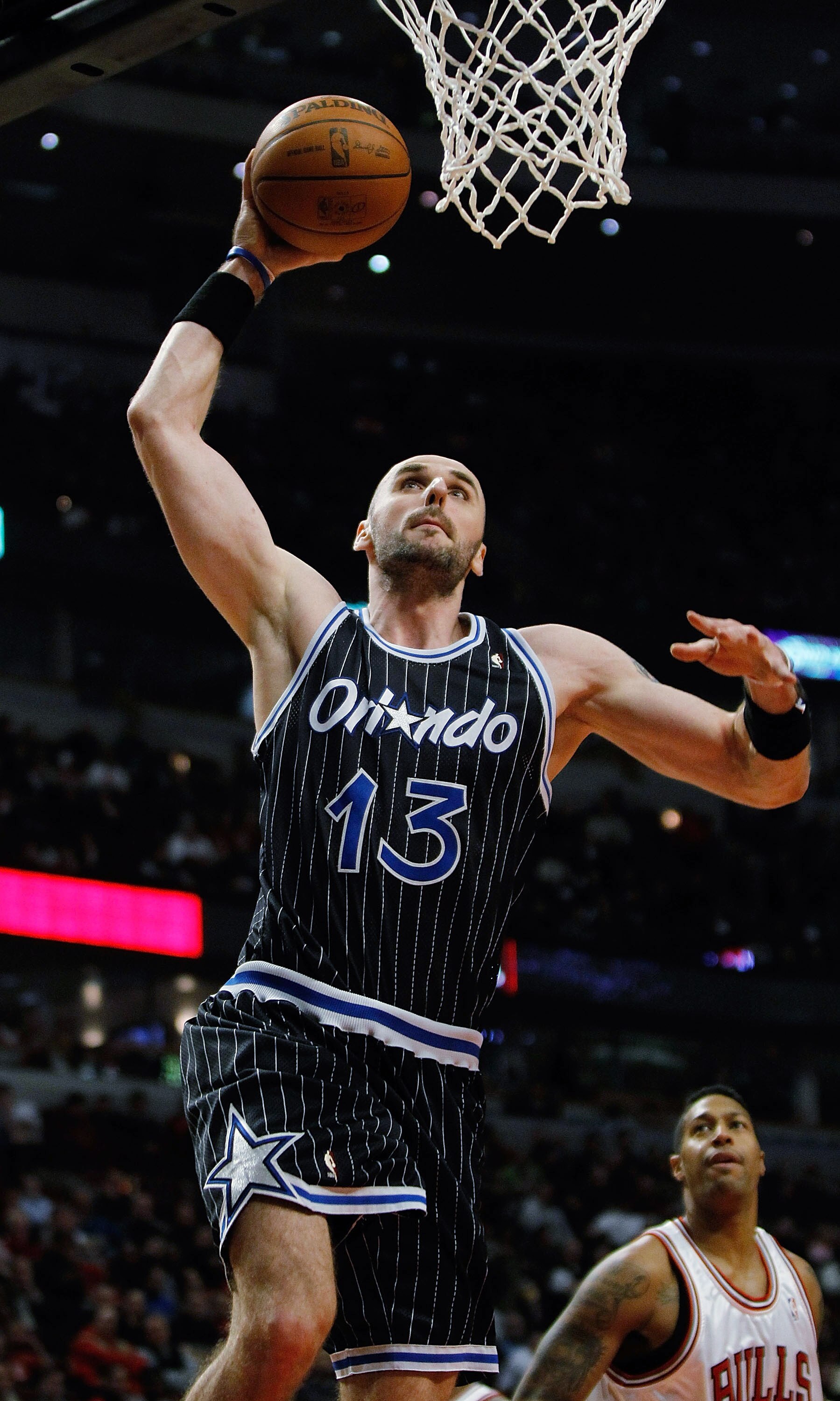 CHICAGO - FEBRUARY 10: Marcin Gortat #13 of the Orlando Magic goes up for a dunk against the Chicago Bulls at the United Center on February 10, 2010 in Chicago, Illinois. The Magic defeated the Bulls 107-87. NOTE TO USER: User expressly acknowledges and a