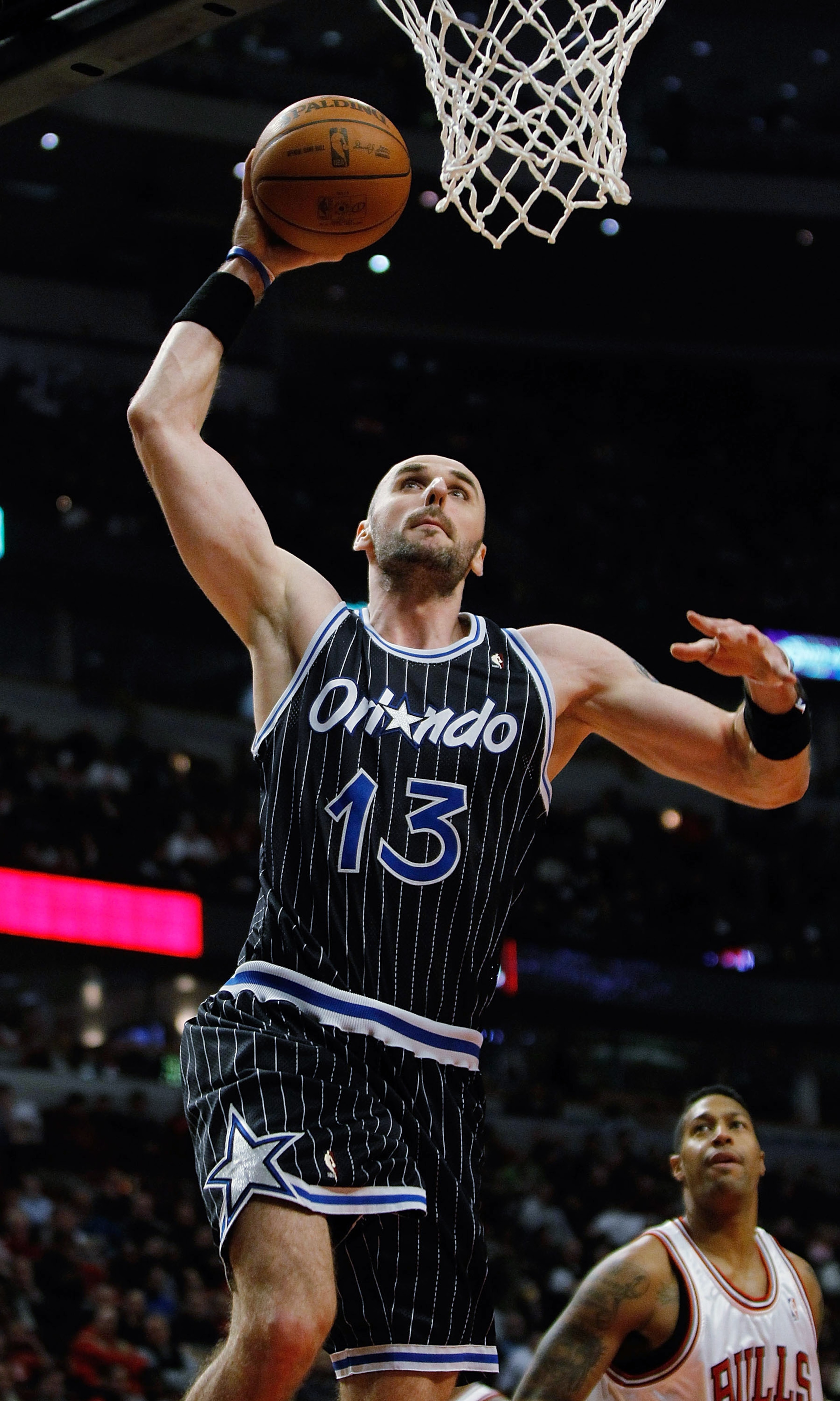 CHICAGO - FEBRUARY 10: Marcin Gortat #13 of the Orlando Magic goes up for a dunk against the Chicago Bulls at the United Center on February 10, 2010 in Chicago, Illinois. The Magic defeated the Bulls 107-87. NOTE TO USER: User expressly acknowledges and a