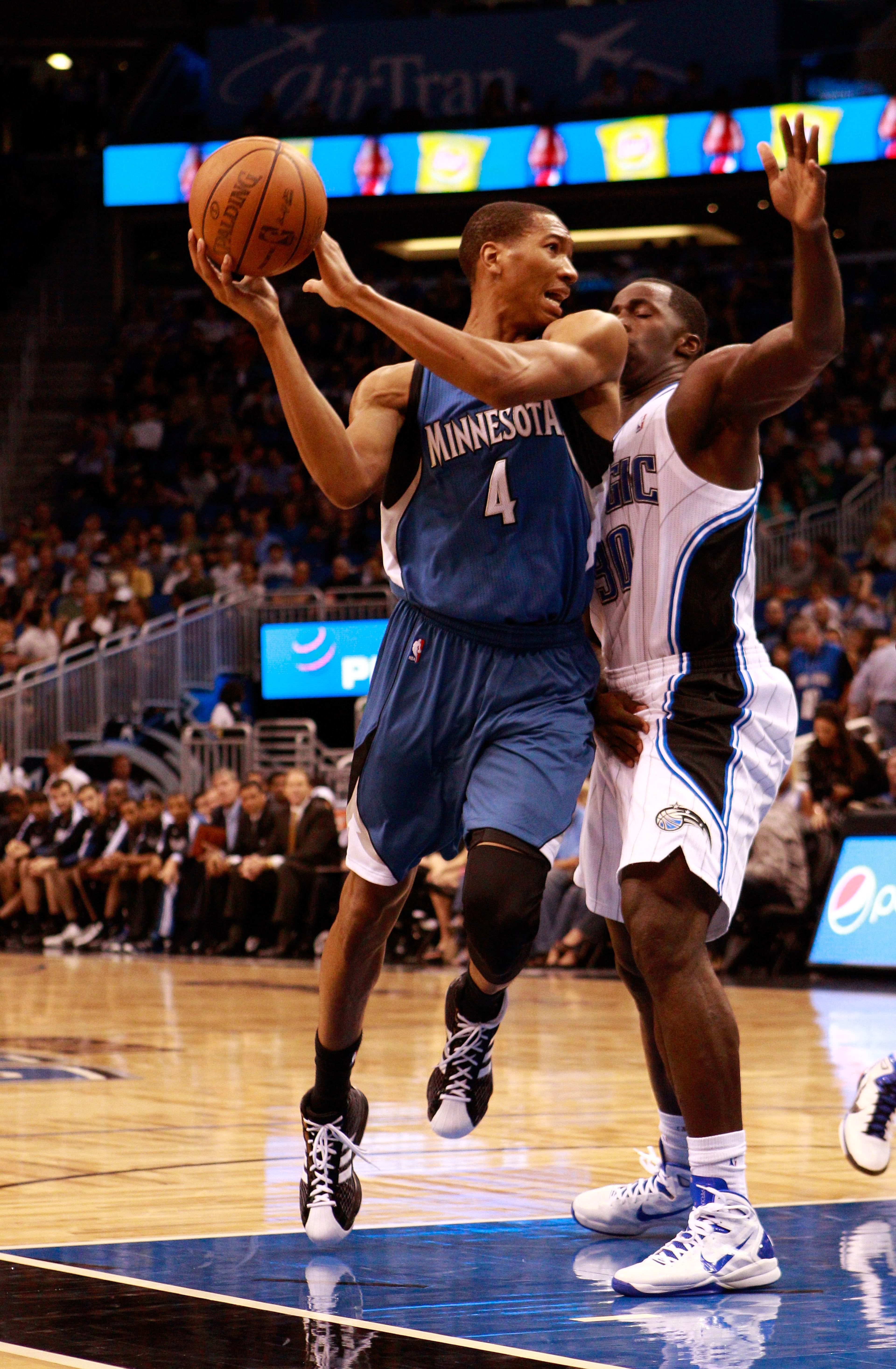 ORLANDO, FL - NOVEMBER 03: Wesley Johnson #4 of the Minnesota Timberwolves attempts to pass against Brandon Bass #30 of the Orlando Magic during the game at Amway Arena on November 3, 2010 in Orlando, Florida. NOTE TO USER: User expressly acknowledges a ORLANDO, FL - NOVEMBER 03: Wesley Johnson #4 of the Minnesota Timberwolves attempts to pass against Brandon Bass #30 of the Orlando Magic during the game at Amway Arena on November 3, 2010 in Orlando, Florida. NOTE TO USER: User expressly acknowledges a
